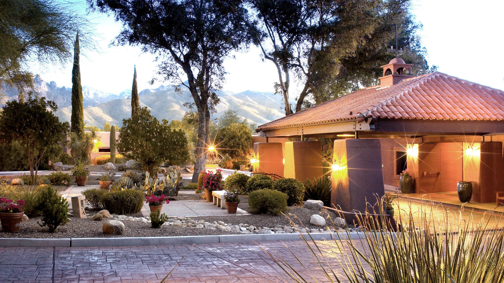 Beautiful exterior shot of the Clubhouse at sunrise and mountains in the background