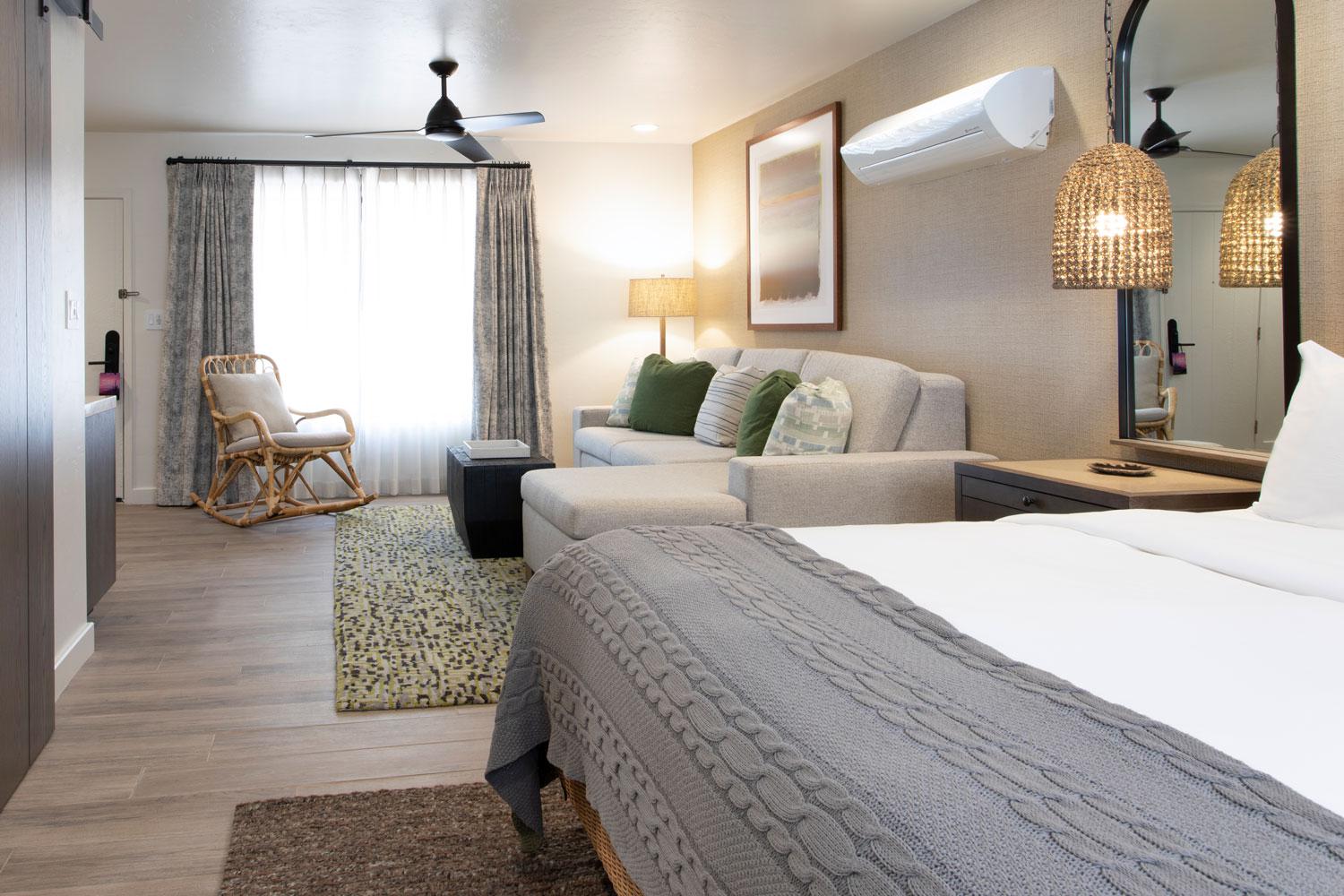 Junior Suite living area with sofas and chair.