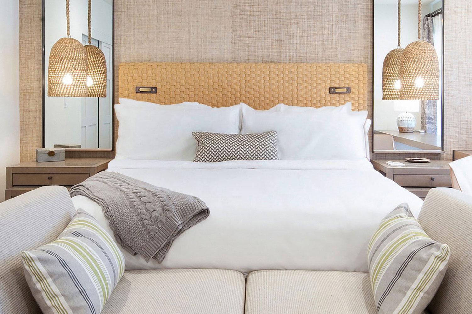 A bed and couch in a luxury bedroom at Canyon Ranch Tucson.