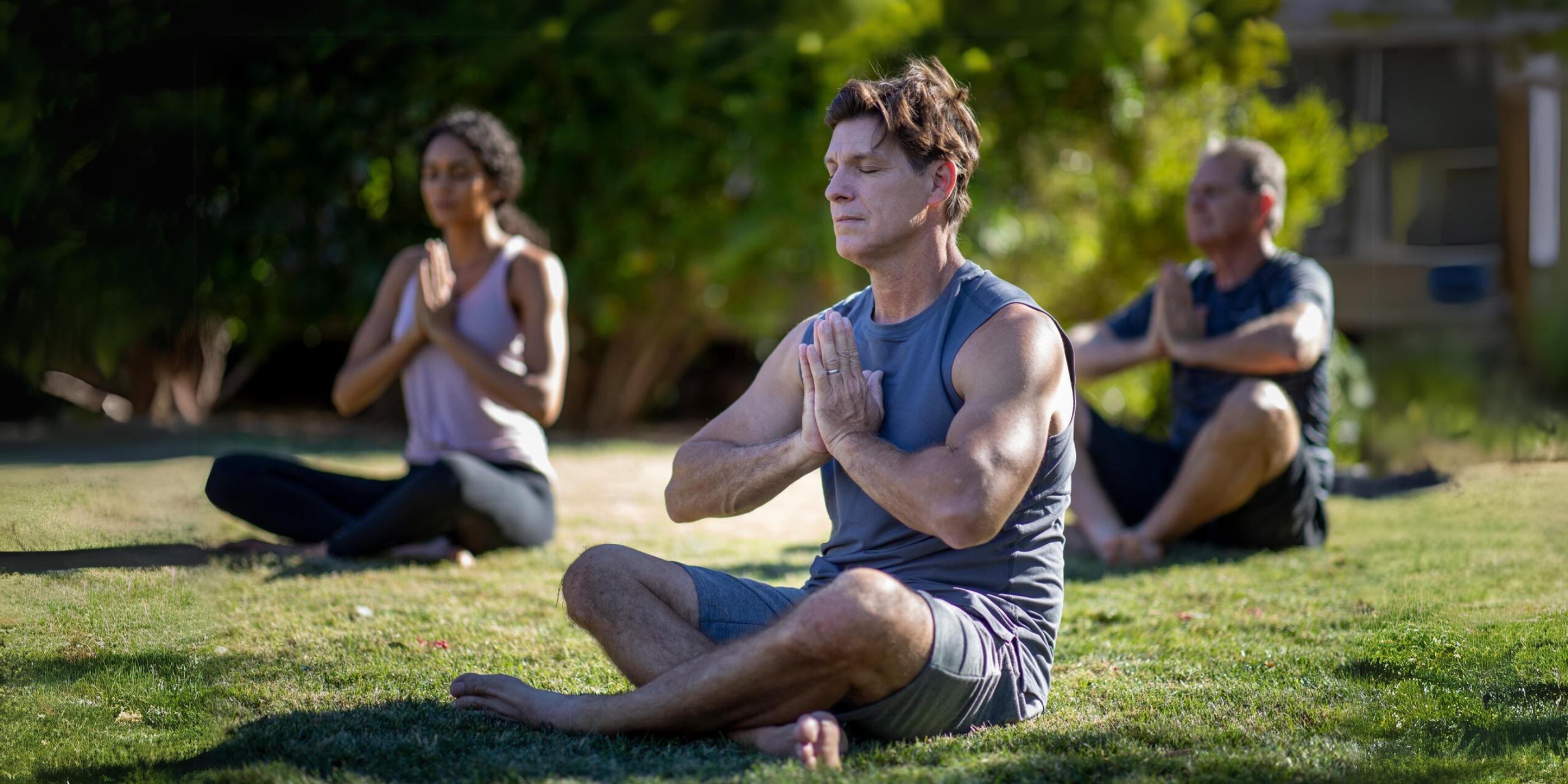 A group meditating on the lawn at Canyon Ranch Tucson health spa