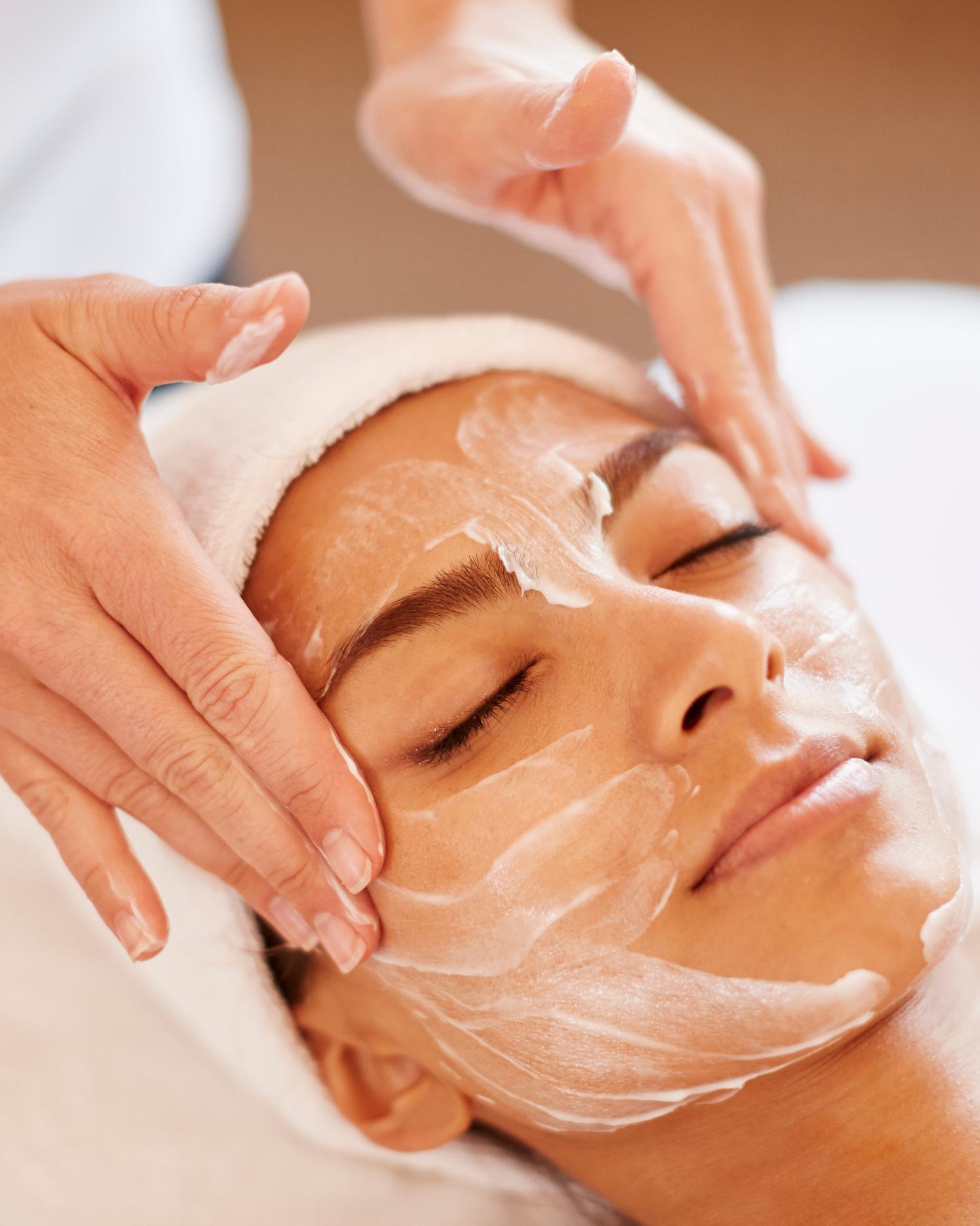 a woman getting a facial at Canyon Ranch Fort Worth Wellness Club + Spa