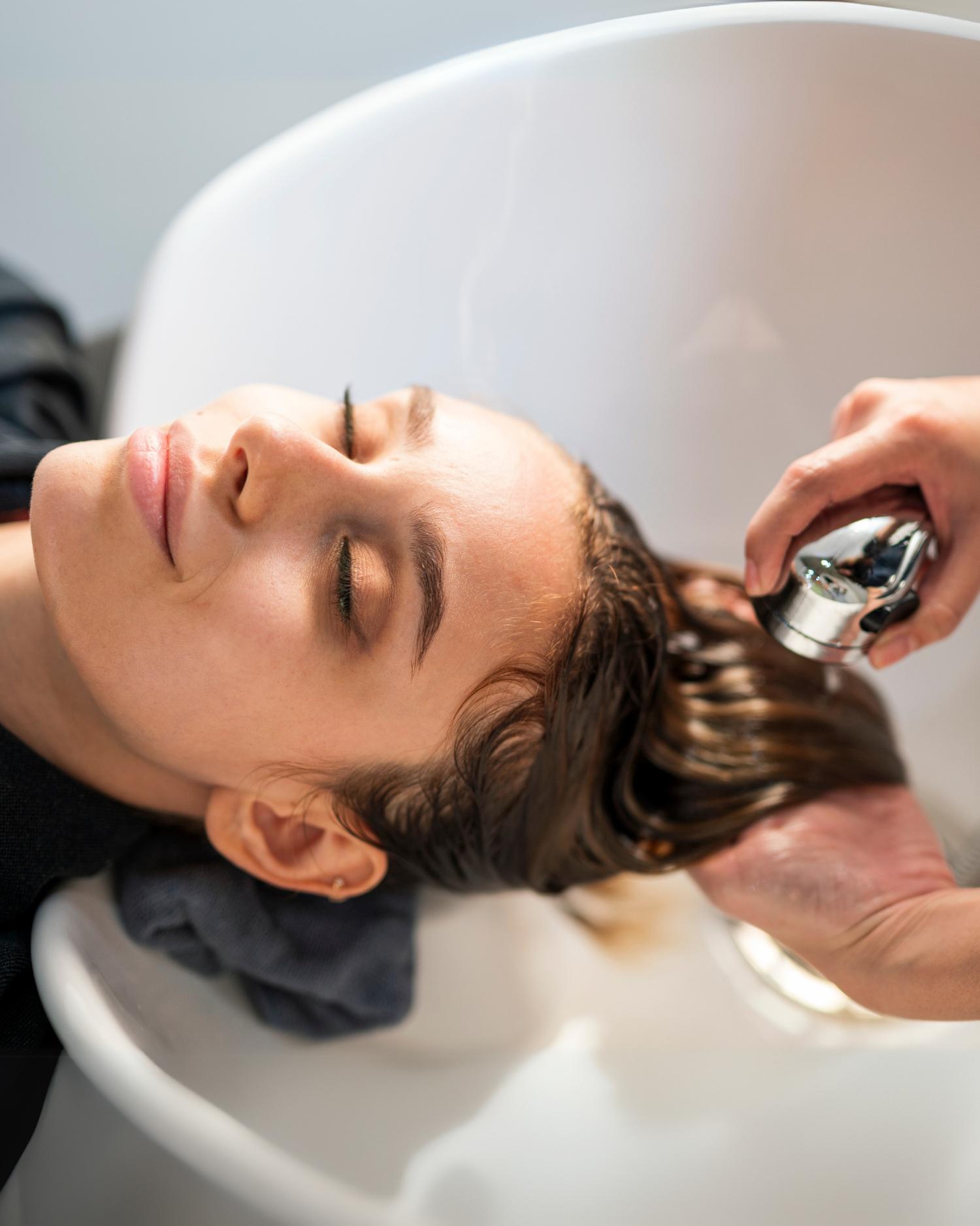 a woman getting highlights at Canyon Ranch Fort Worth Wellness Club + Spa