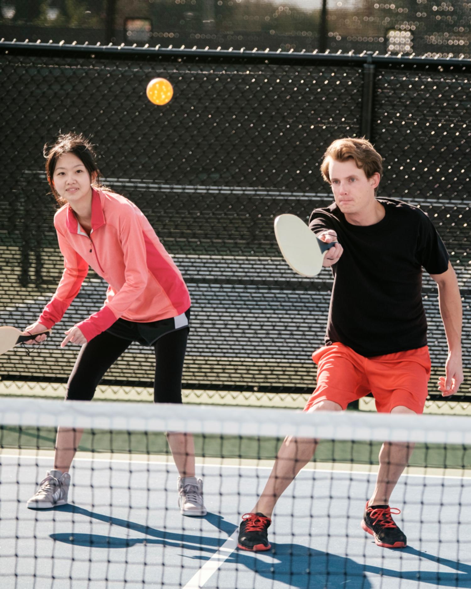 A group of young adults playing pickleball at the Fitness Center at Canyon Ranch Lenox Health Spa Resort