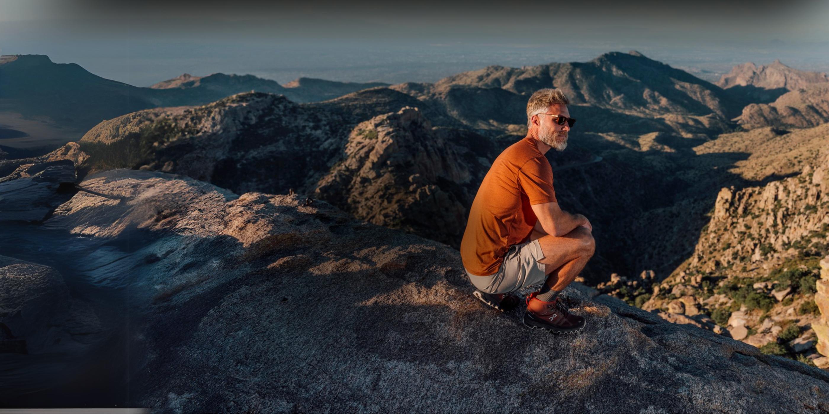 A man standing on a mountain top