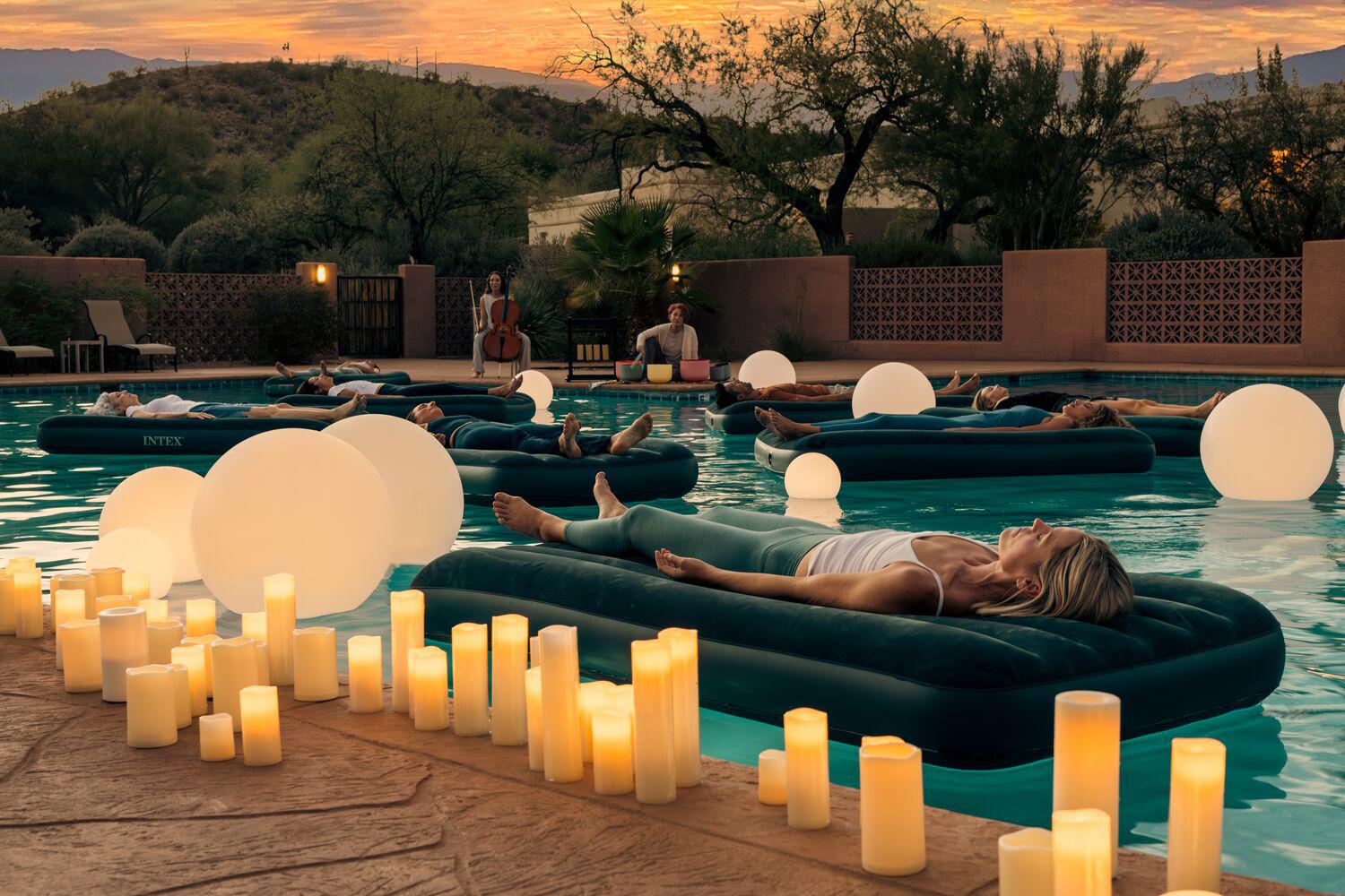 a group floating in the pool
