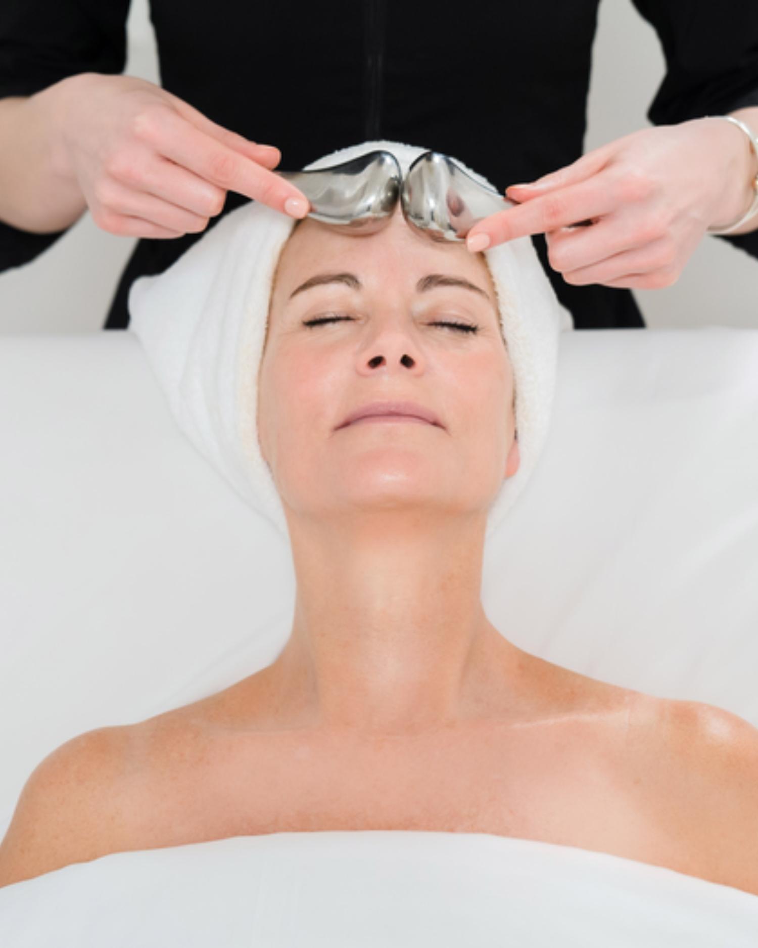 Image of woman getting facial treatment.