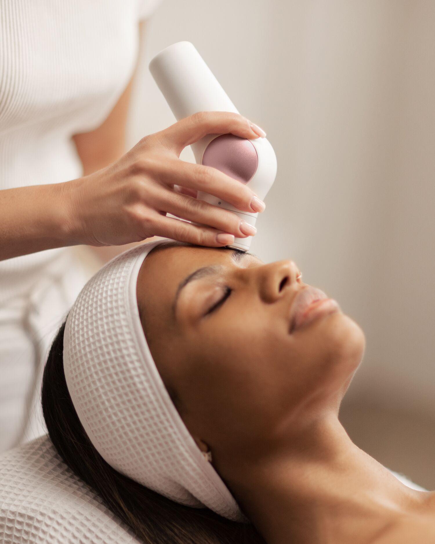 Overhead view image of woman getting a facial.