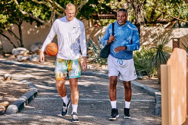 two men walking on the Canyon Ranch Tucson Wellness + Spa Resort