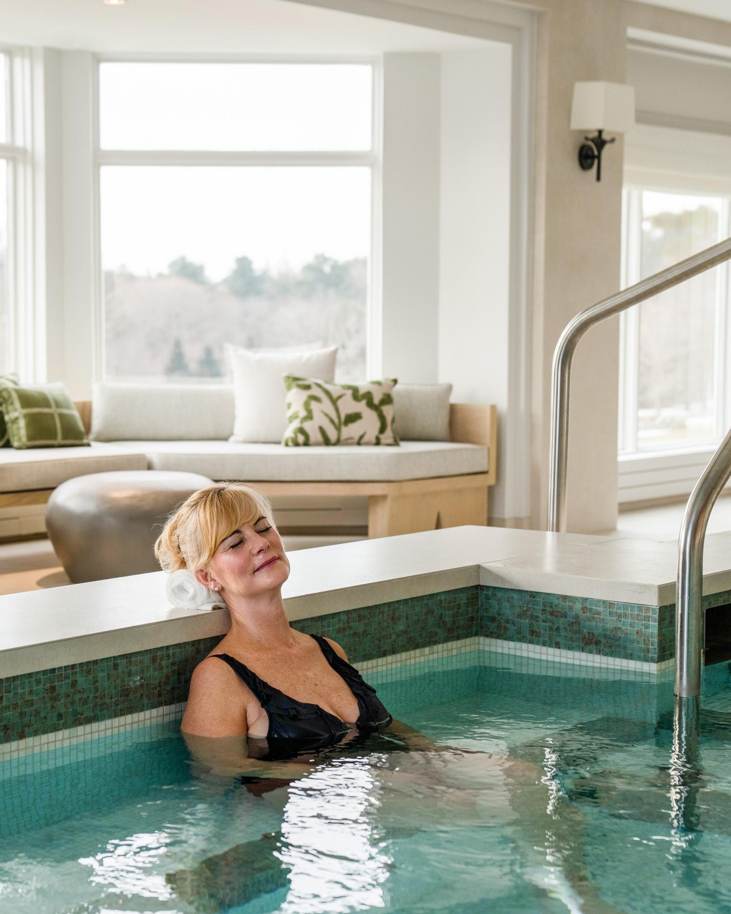 Image of woman relaxing in pool.
