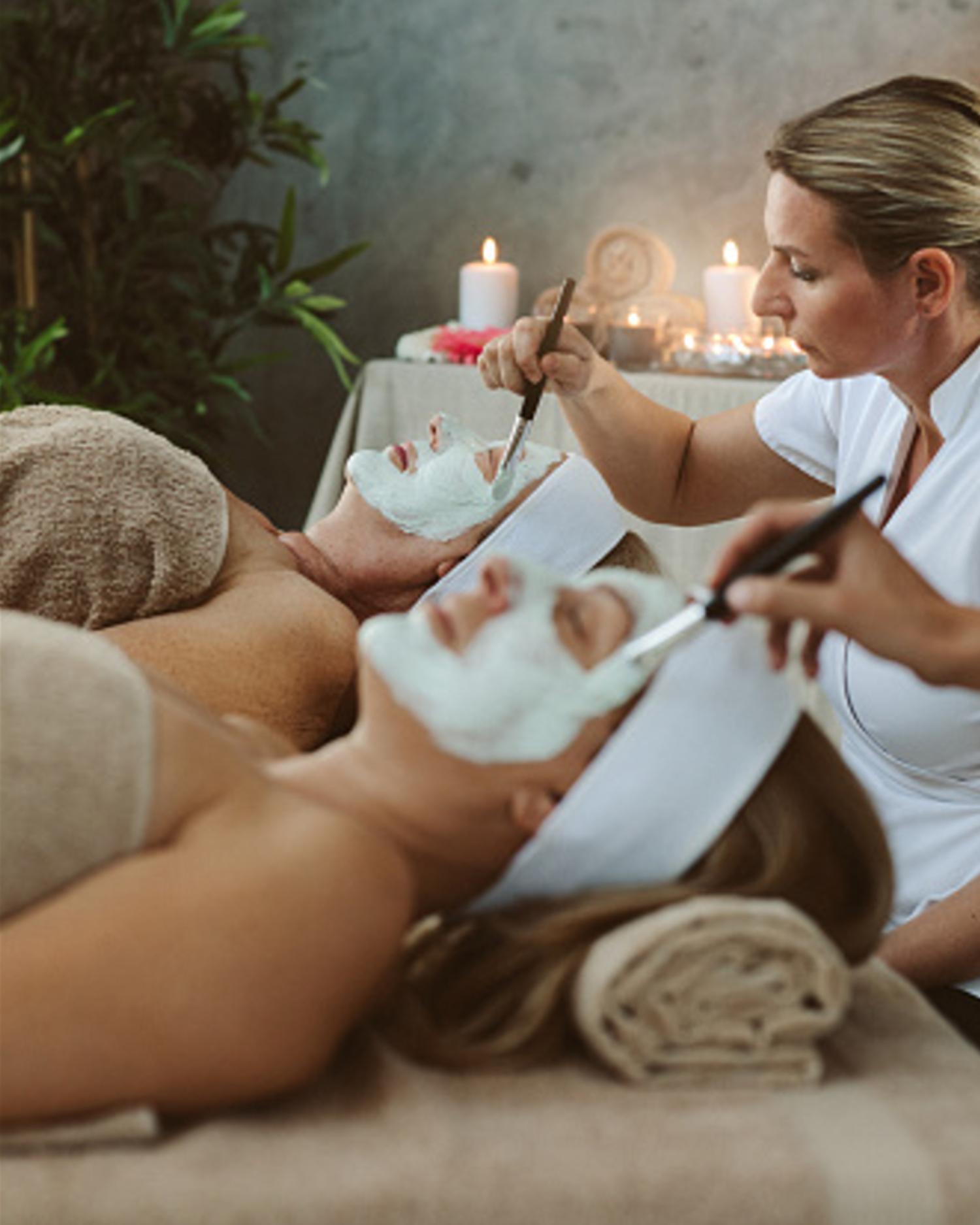 a mother and daughter getting a spa service together