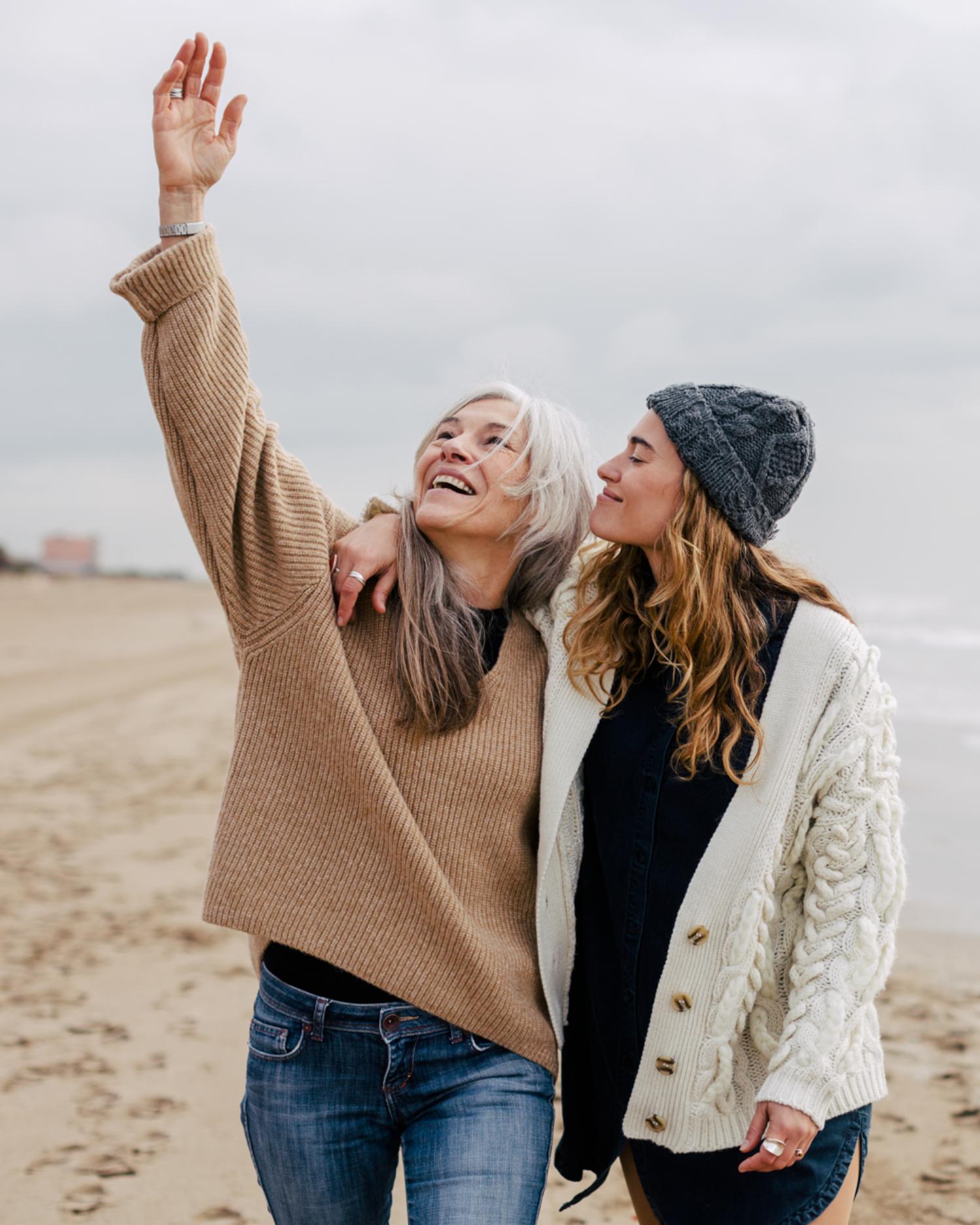 Two women walking on the beach
