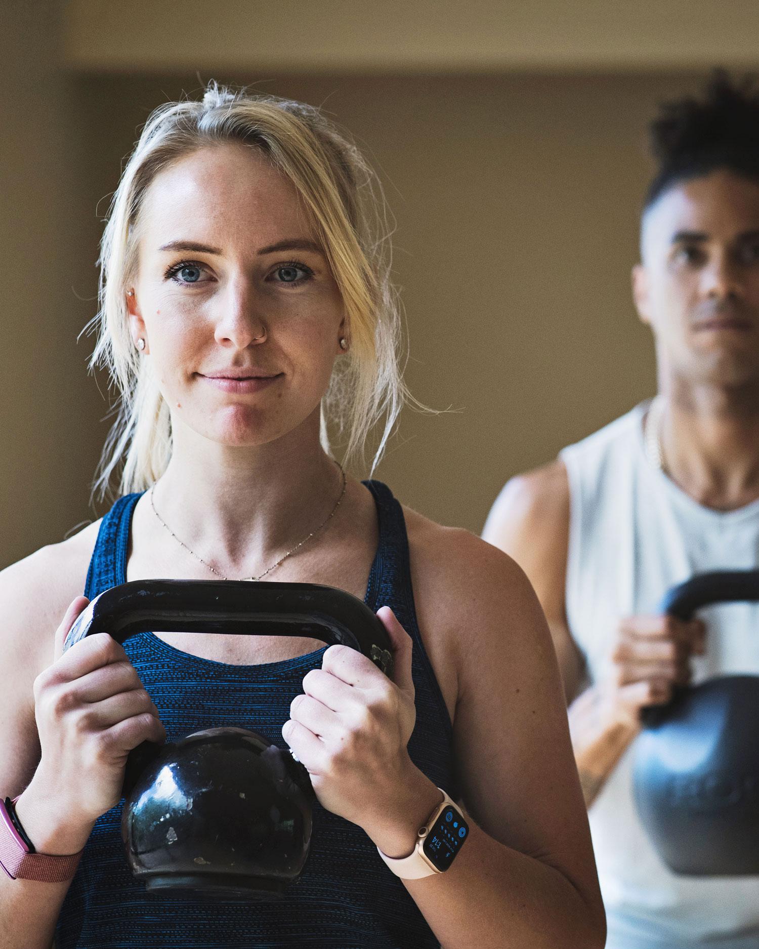 A workout instructor teaching her class 