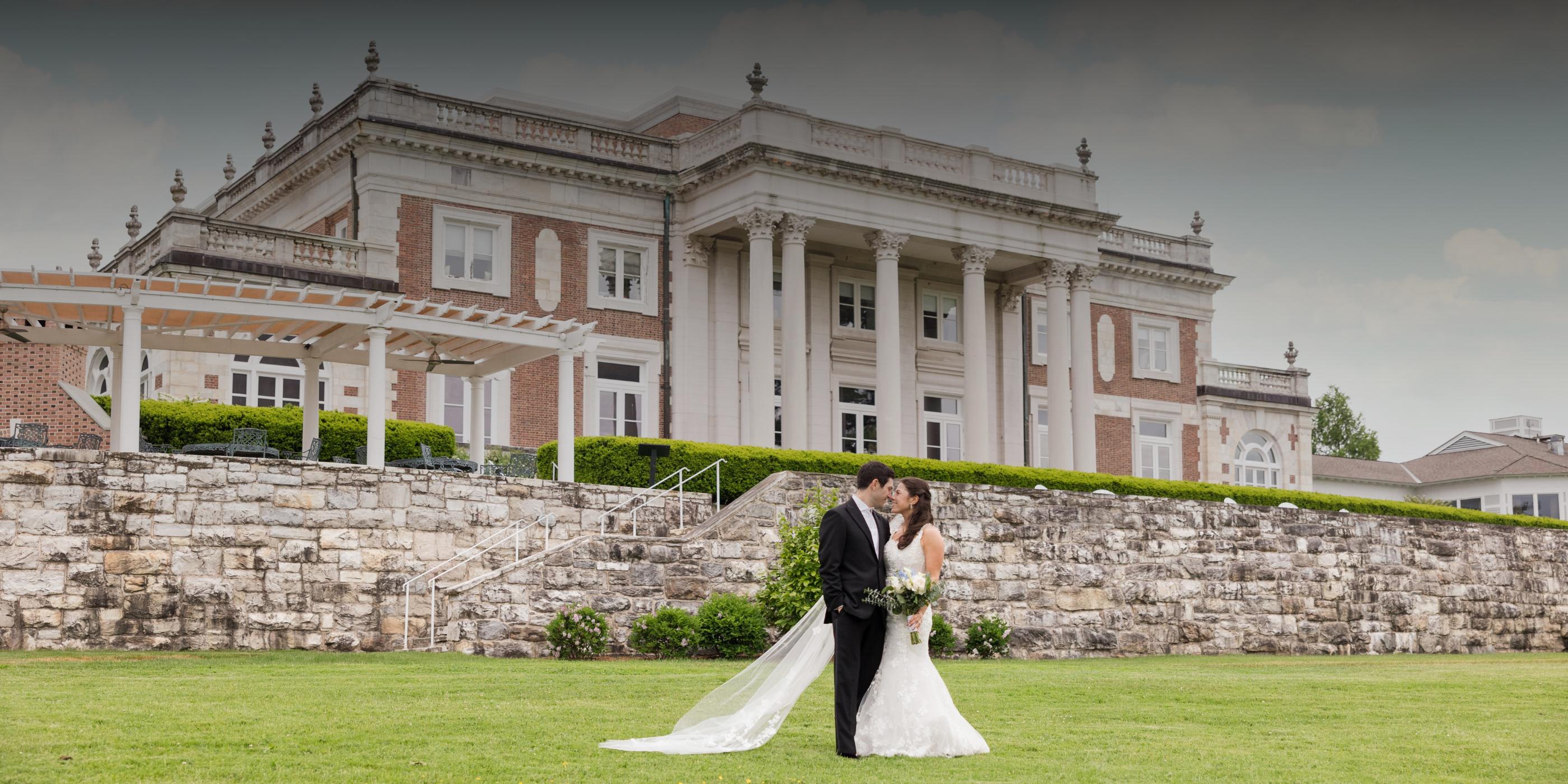 a couple kissing in front of the Canyon Ranch Lenox Wedding Venue