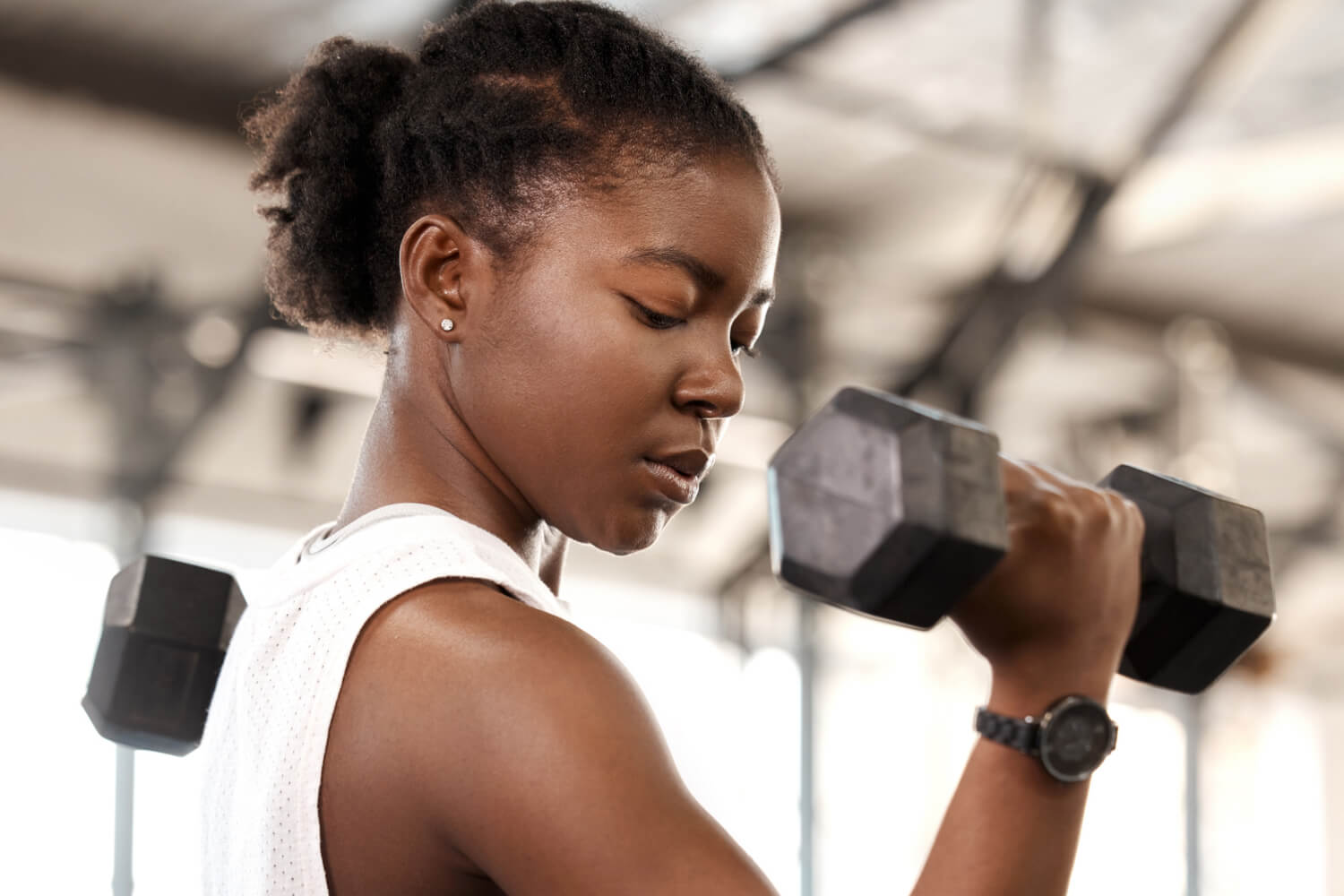 A woman working out with dumbells