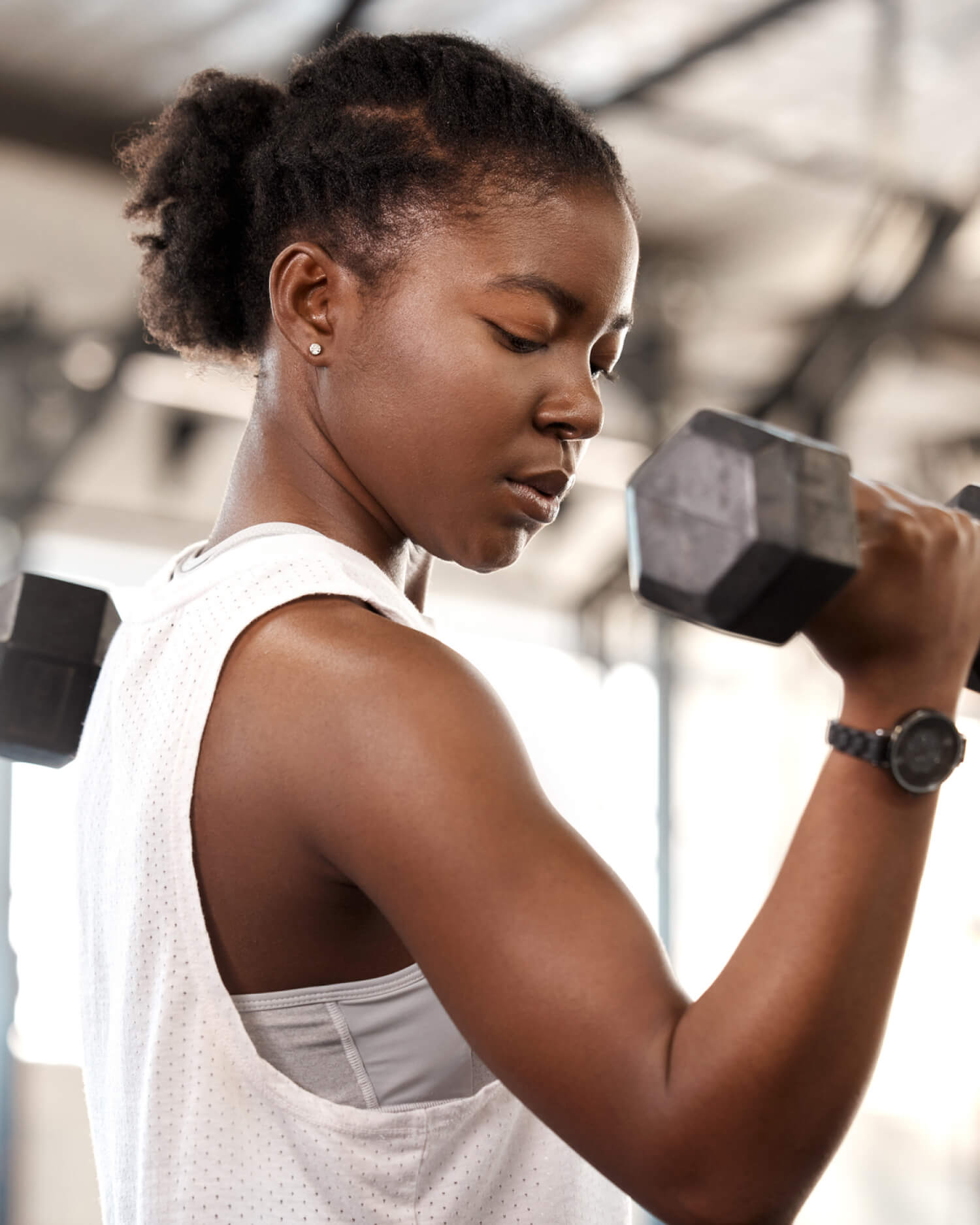 A woman working out with dumbells