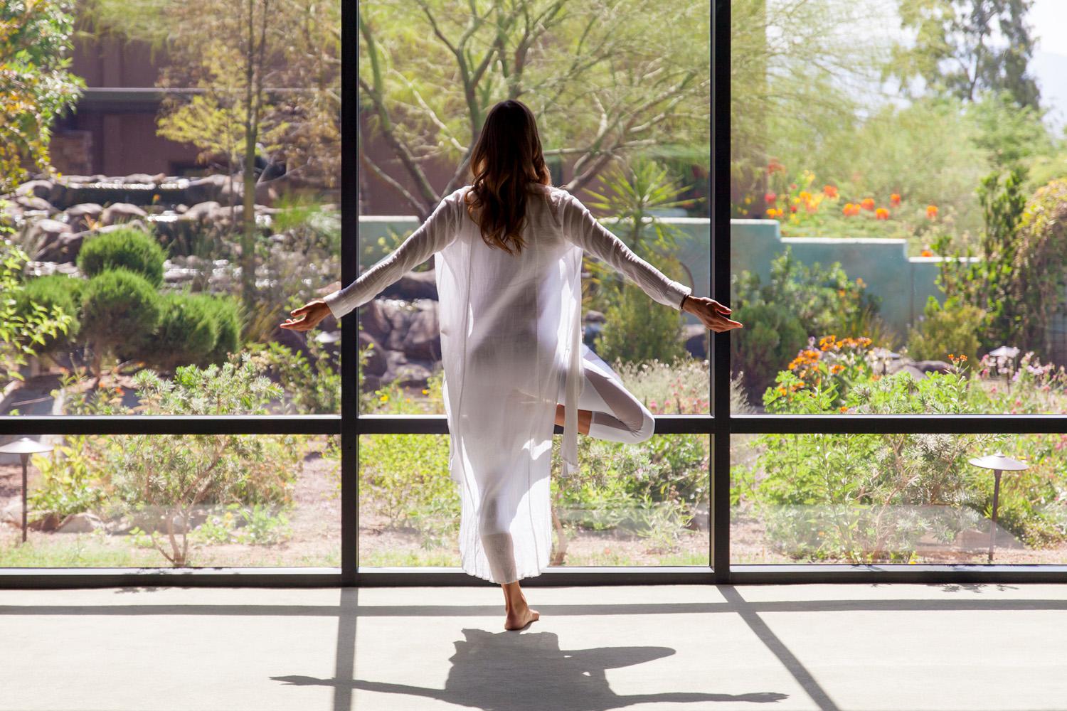 Woman meditating in the Canyon Ranch Tucson Sanctuary