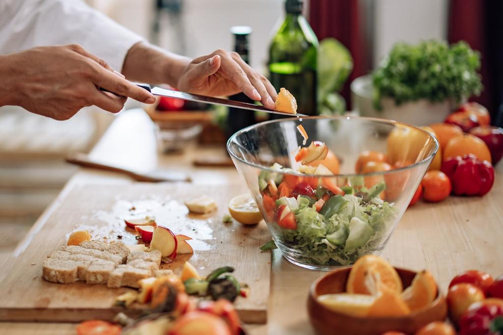 A person cooking a healthy meal