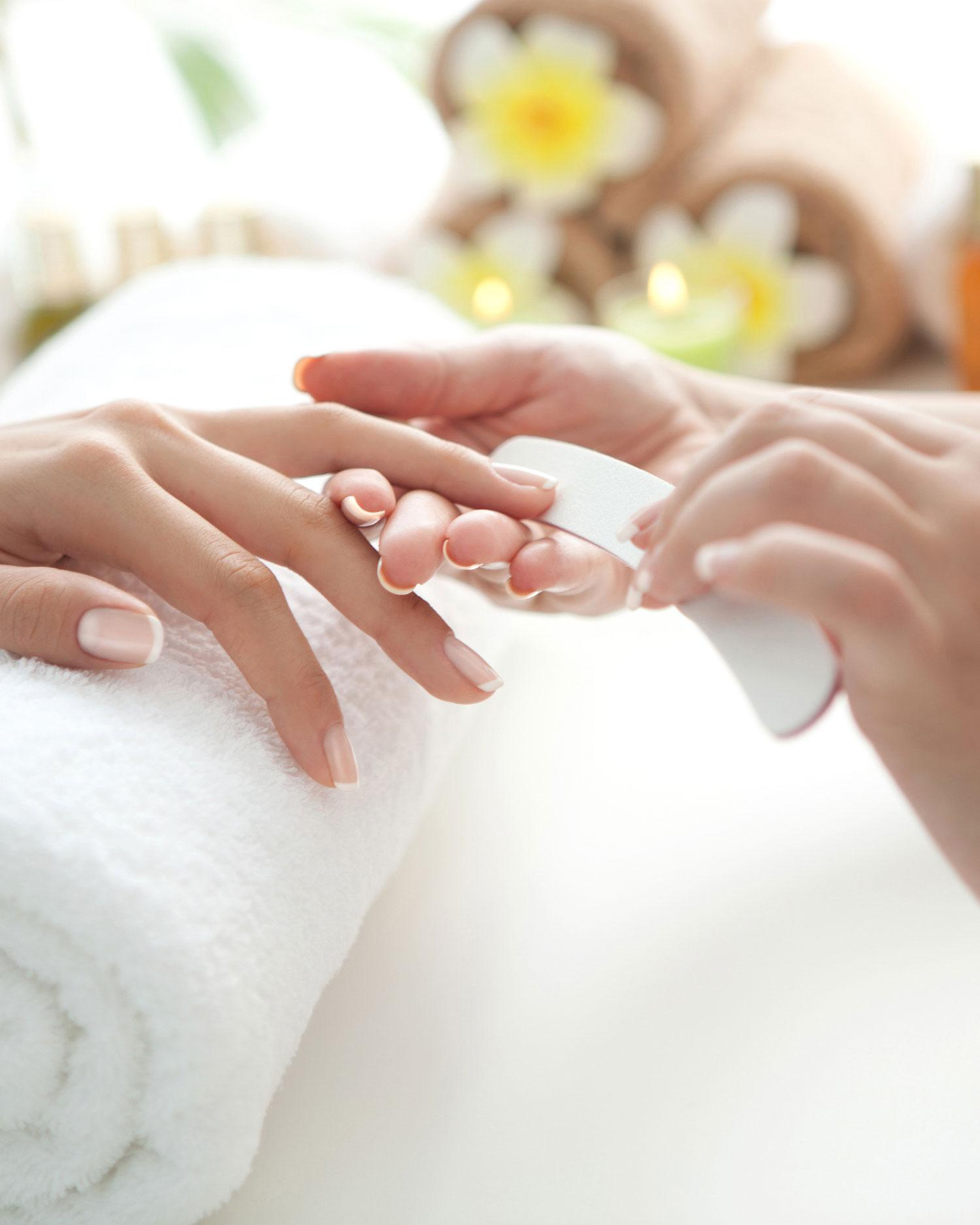 a woman getting a manicure