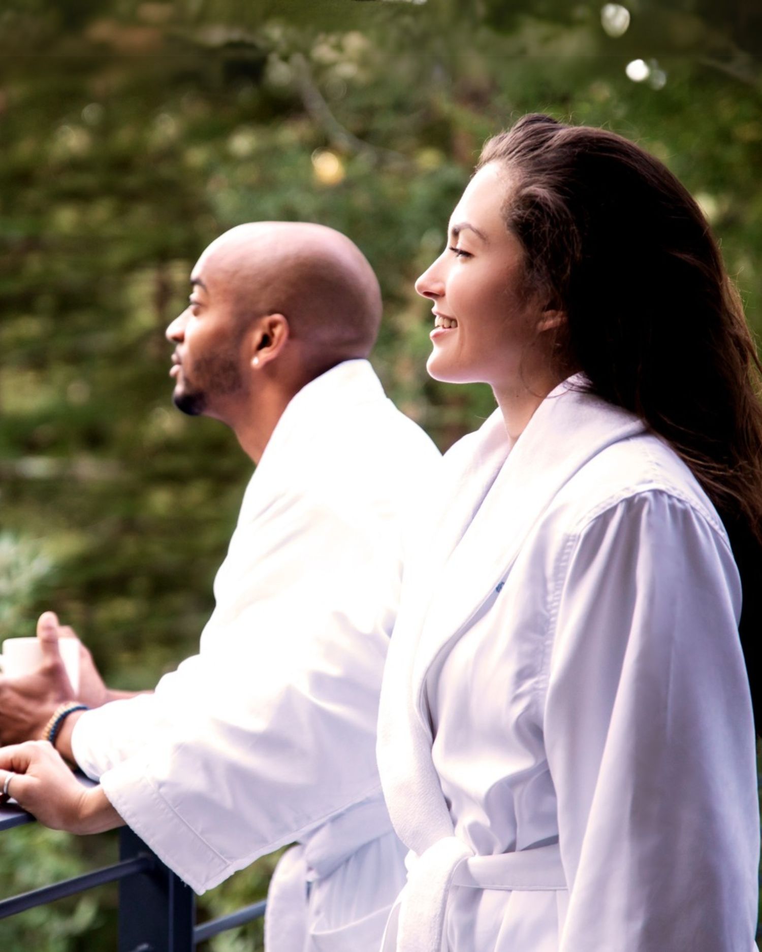 A couple in robes in the forest