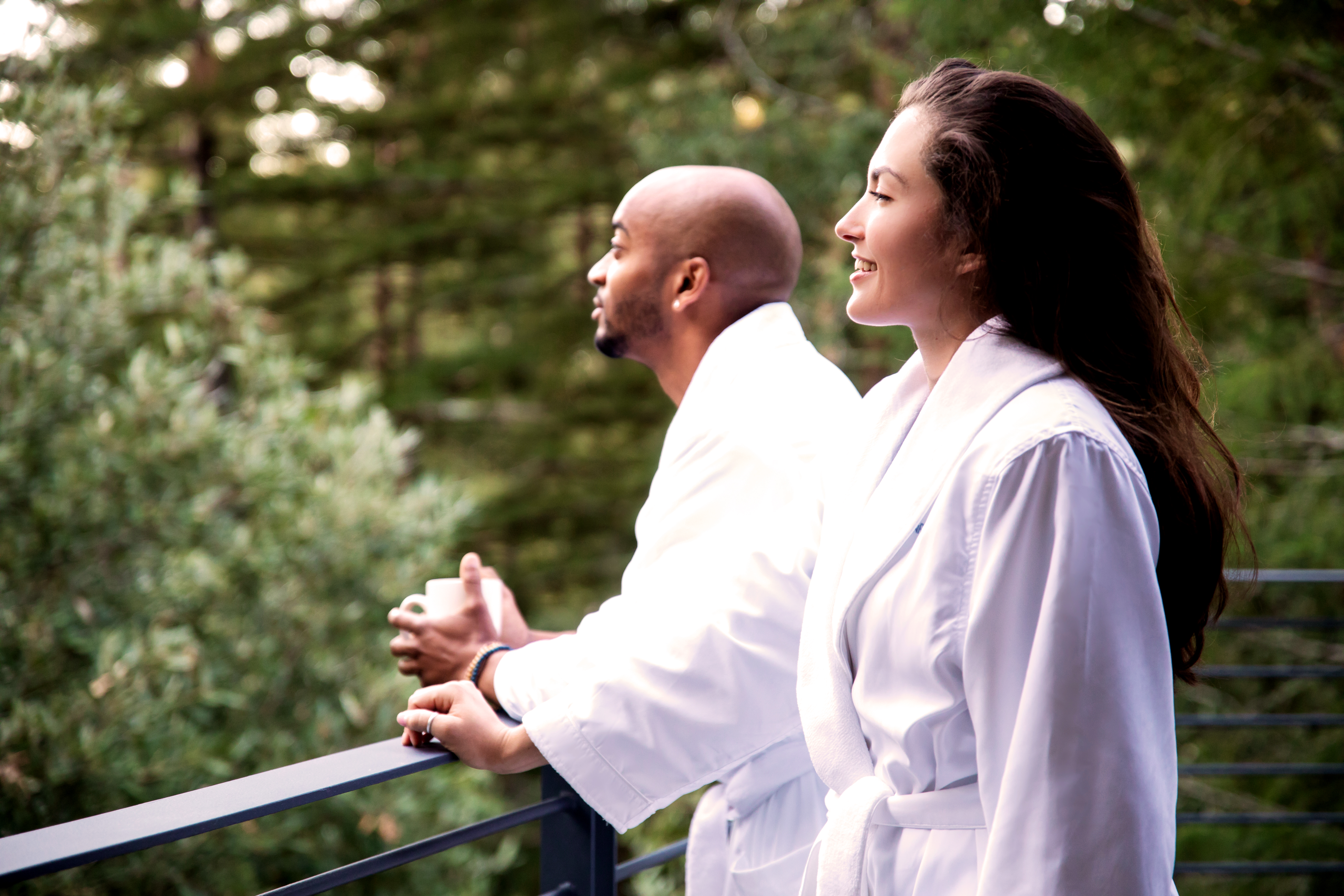 A couple in robes in the forest