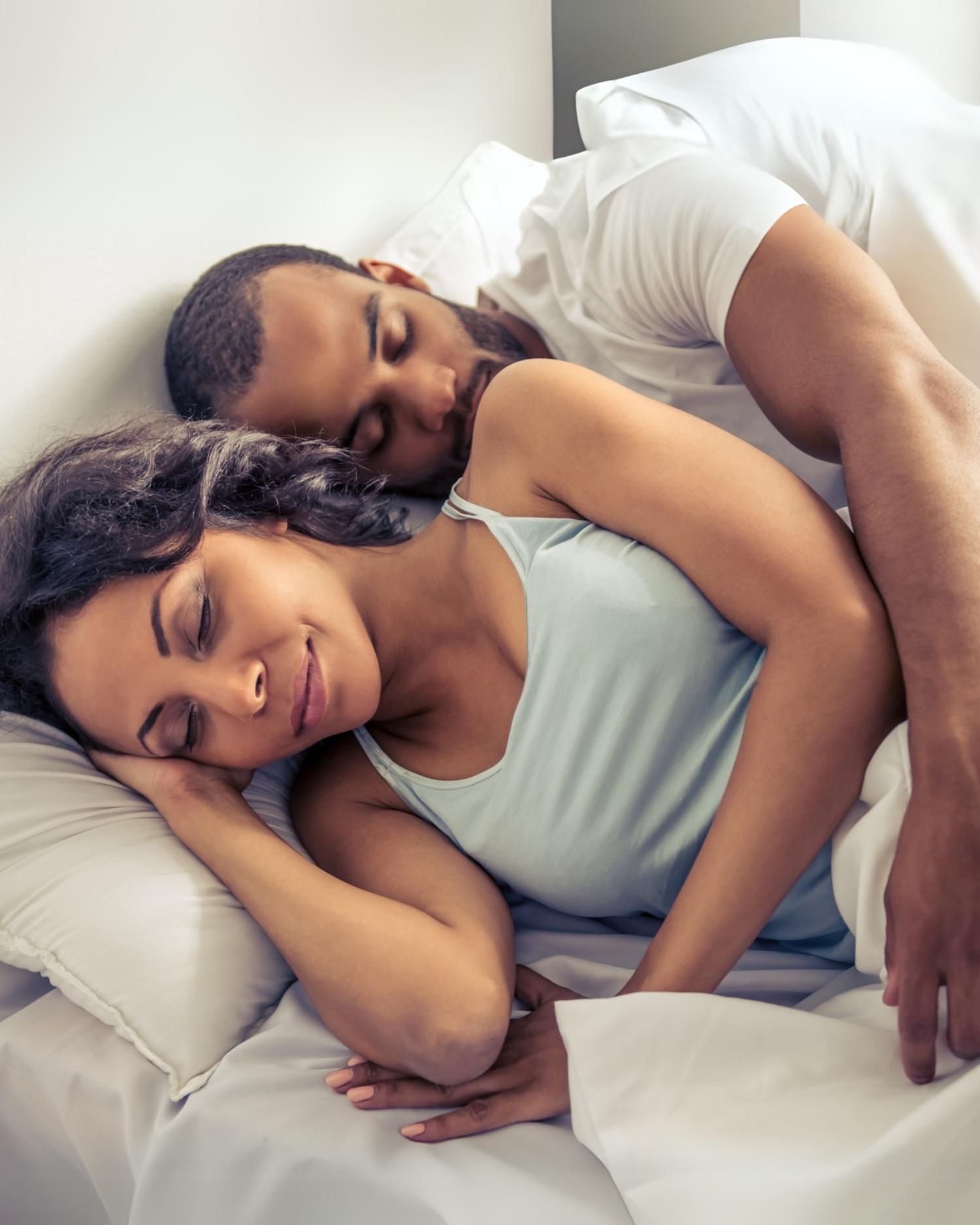 A couple sleeping together contentedly