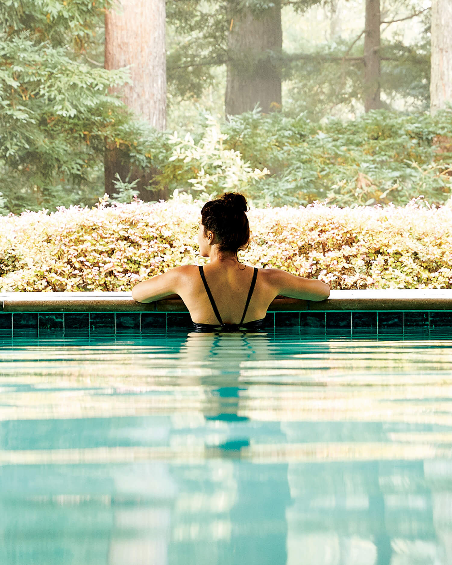 a woman in an indoor pool