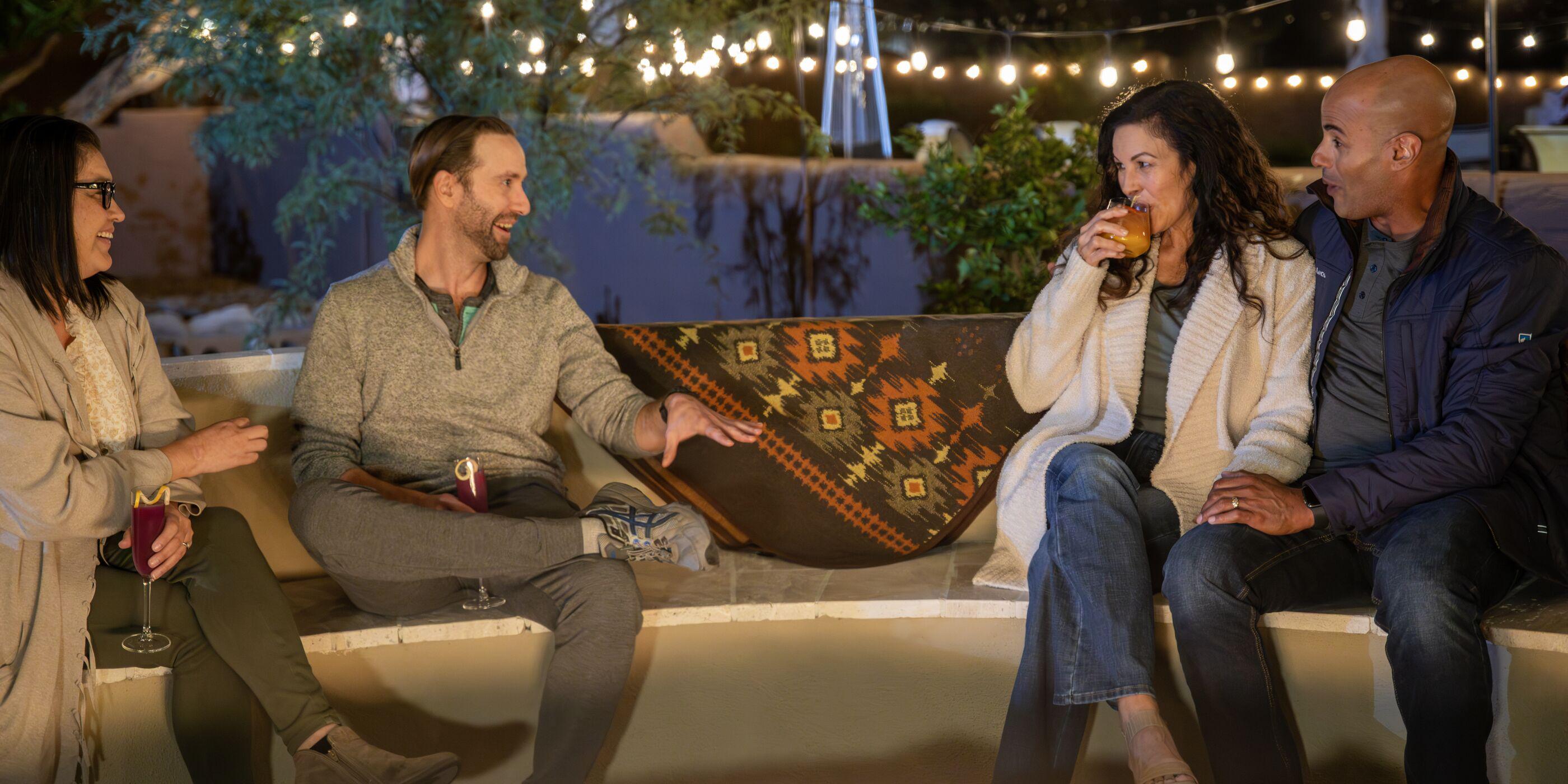 A couple at the Eucalyptus Circle fire pit at Canyon Ranch Tucson Health Spa Resort.
