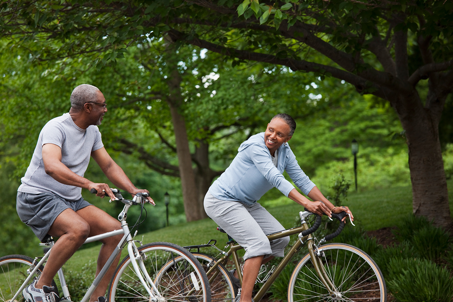 a couple biking in the forest