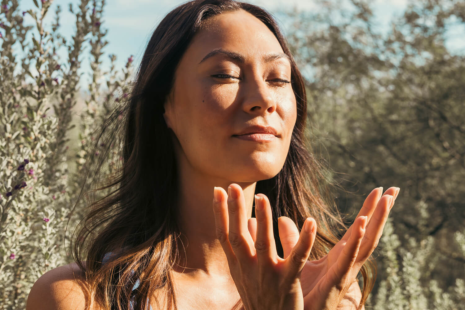 A woman meditating in the desert