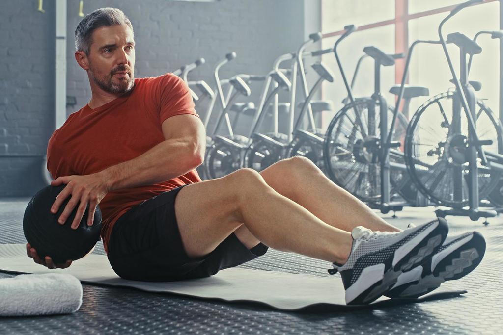 A man working out with a medicine ball