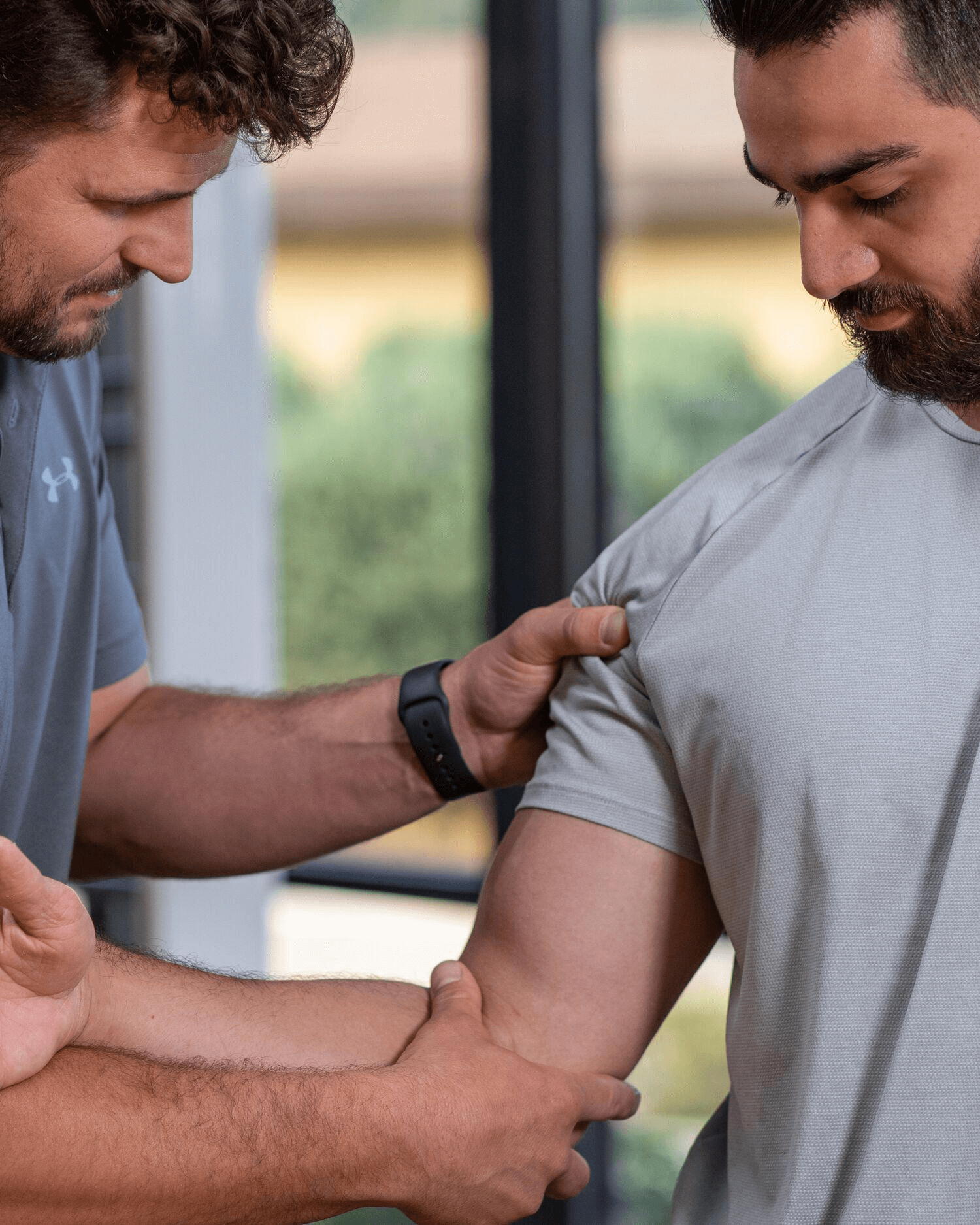 A man getting his elbow evaluated