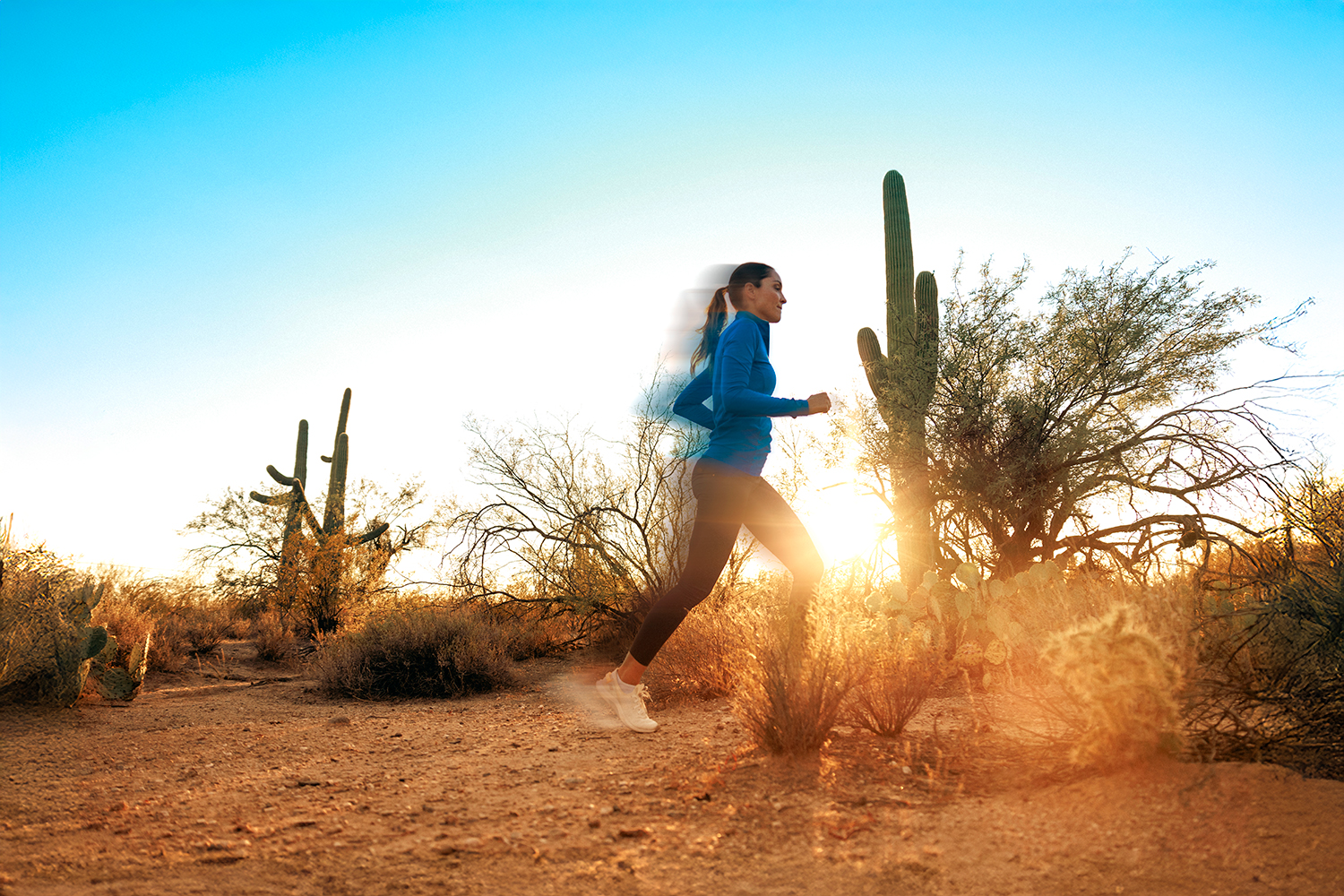 An action spot of a woman running in the desert