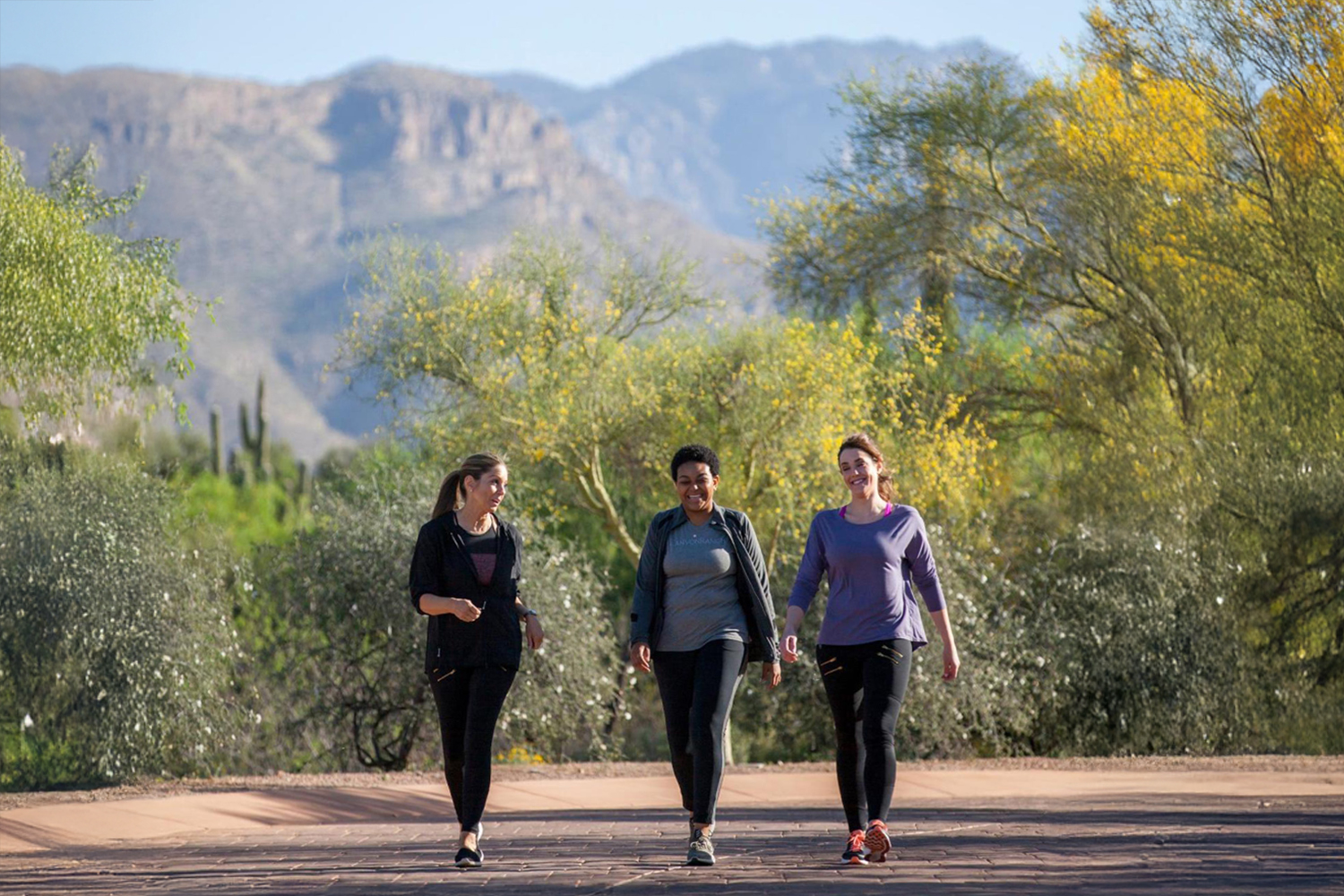 A group of women walking in the desert