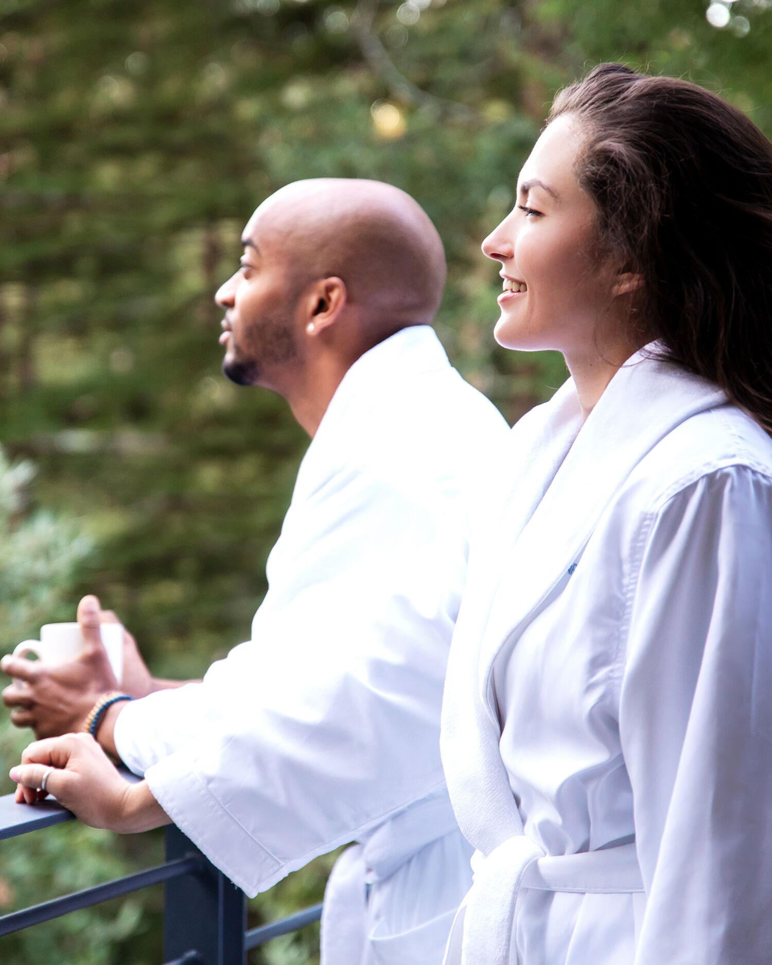 A couple in robes in the forest