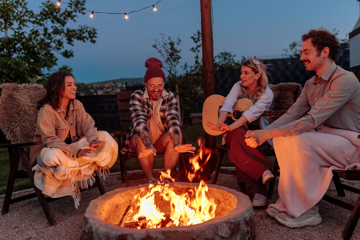 a group of people at a campfire