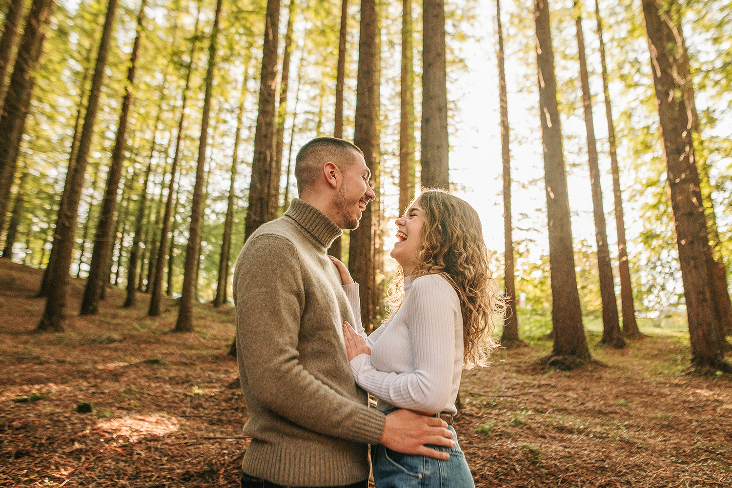 a couple embracing in the redwood forest