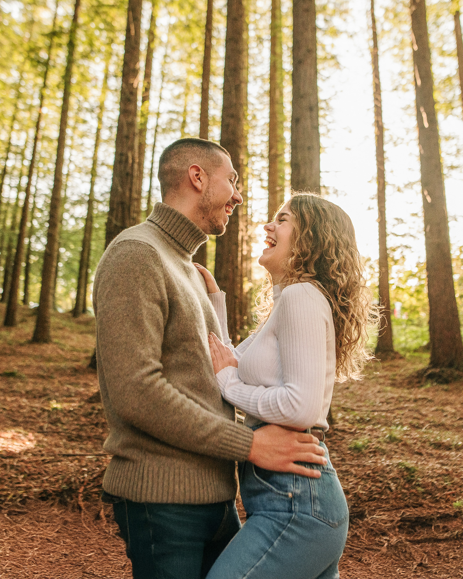 a couple embracing in the redwood forest