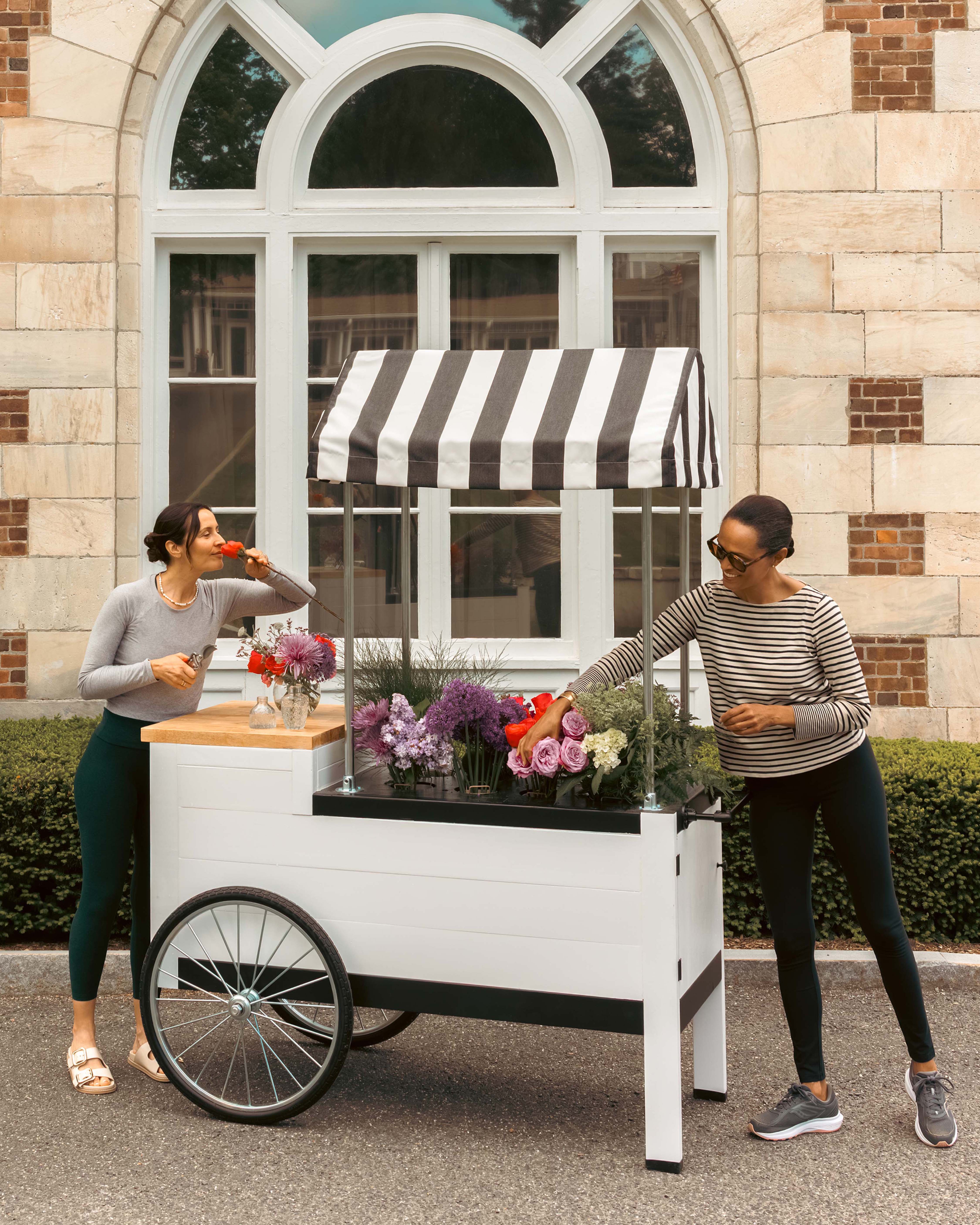 Two Ladies with a collection of flowers