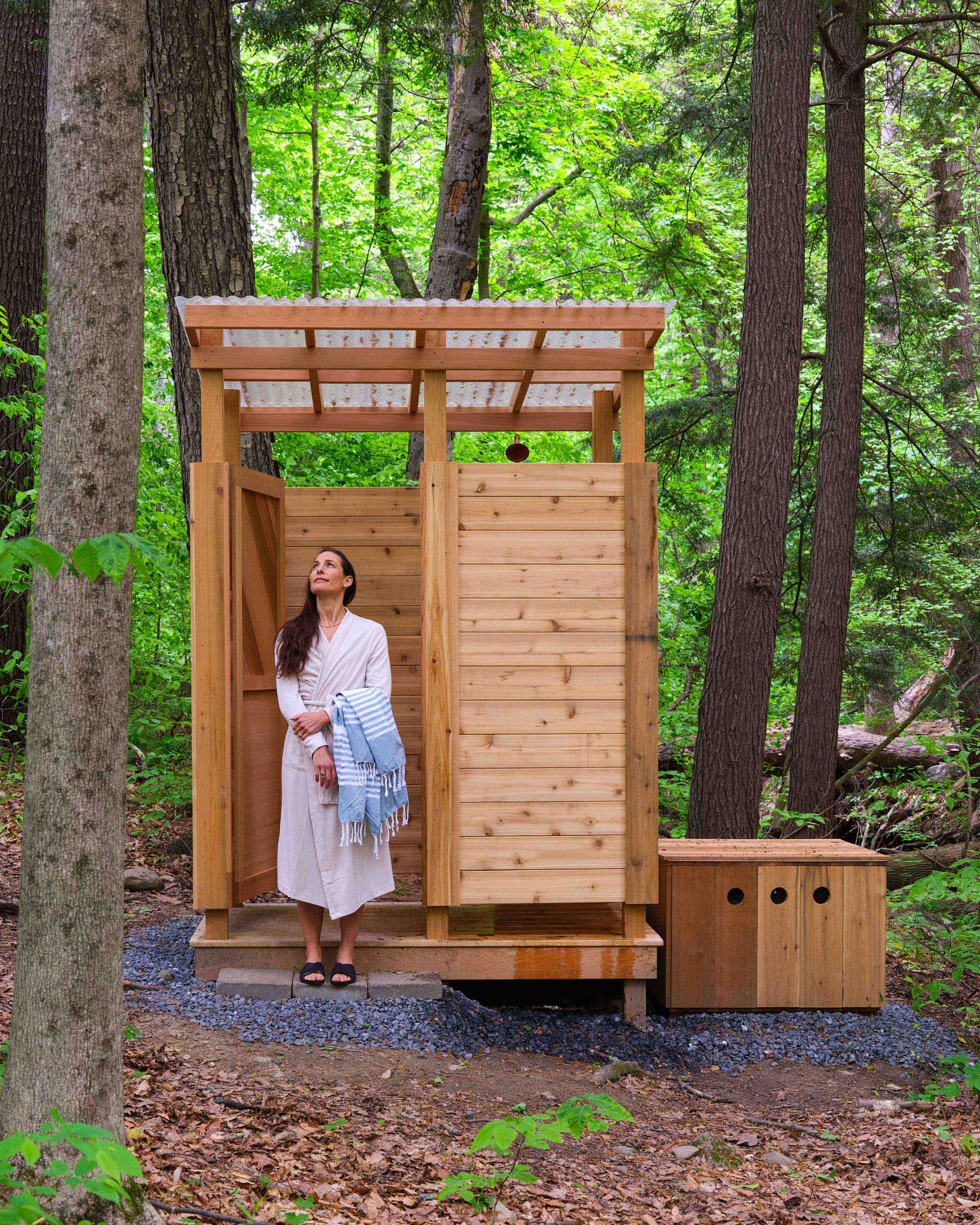 Woman In front of outdoor shower 
