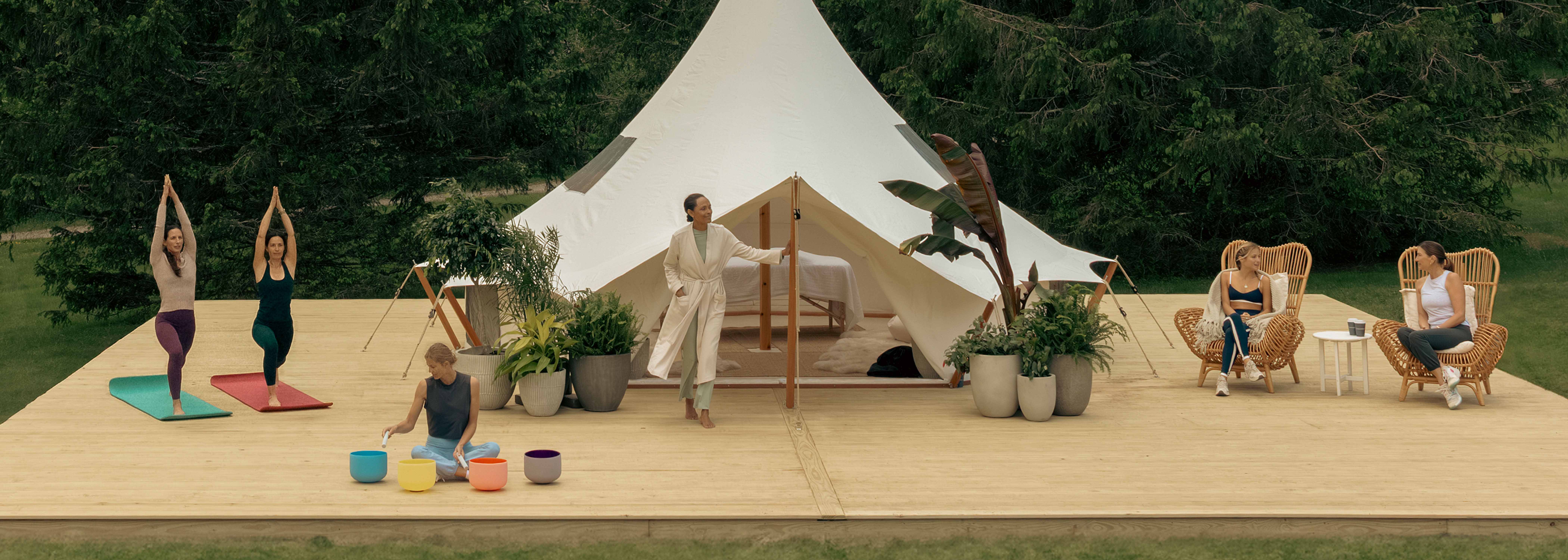 Women glamping in an outdoor tent