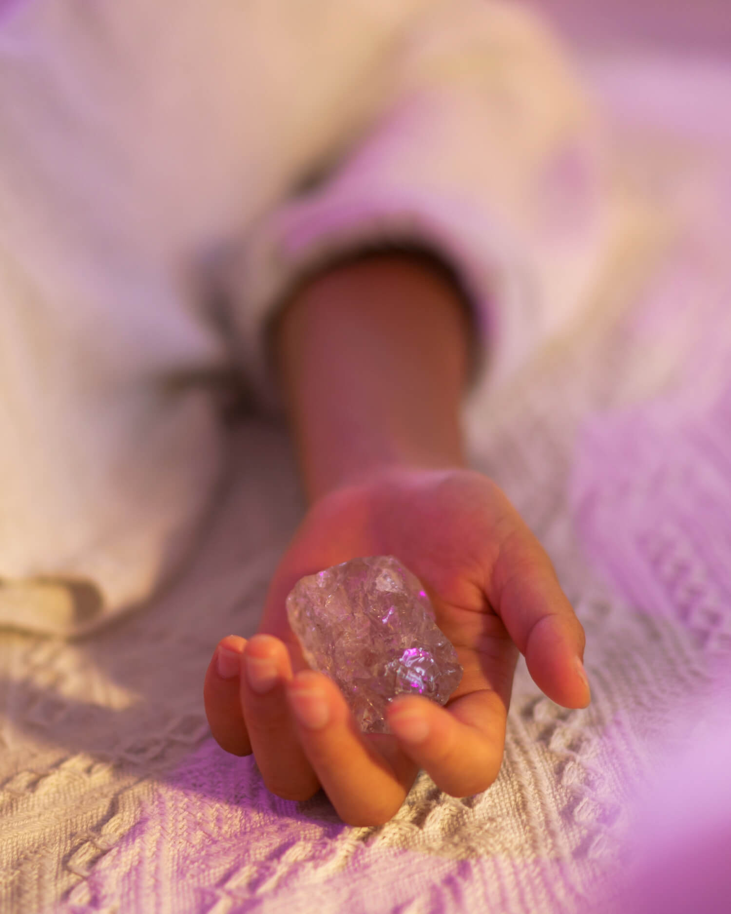 A woman holding a crystal
