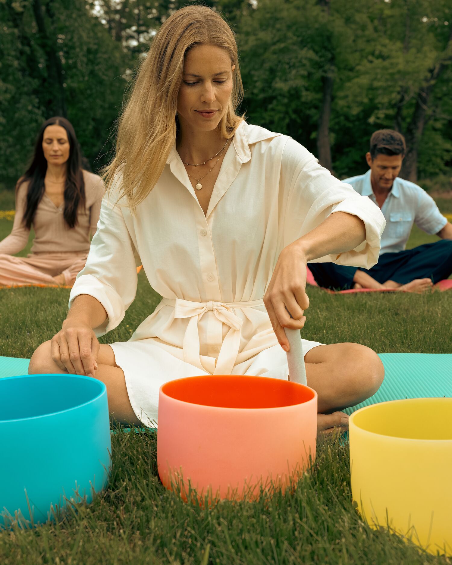 A group having an outdoor sound bath