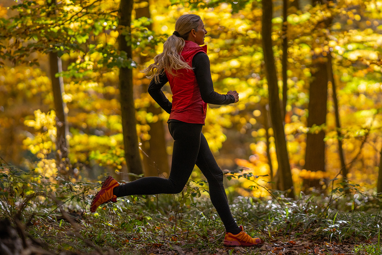 a woman running in the Berkshire Forest