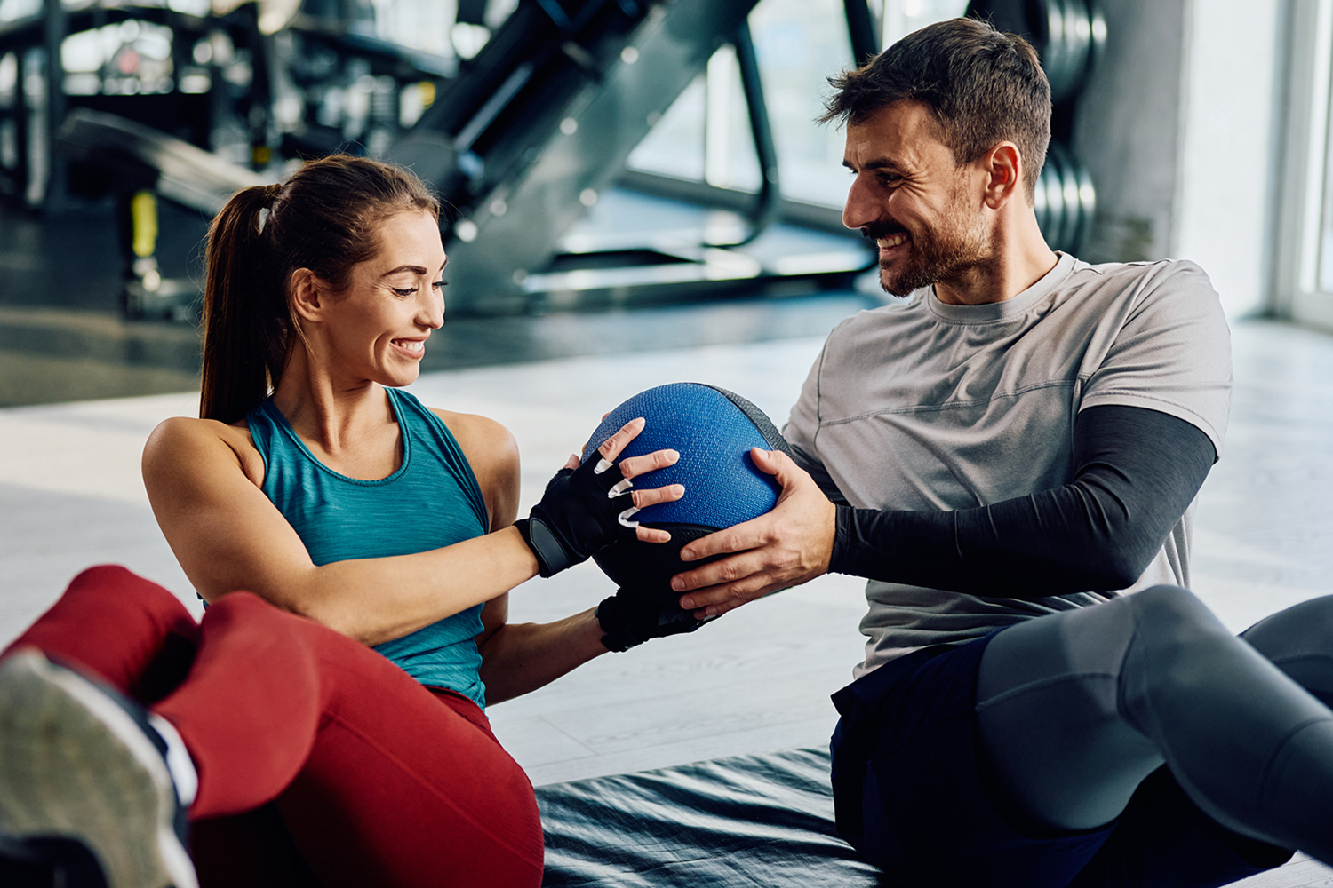 A couple working out with a medicine ball