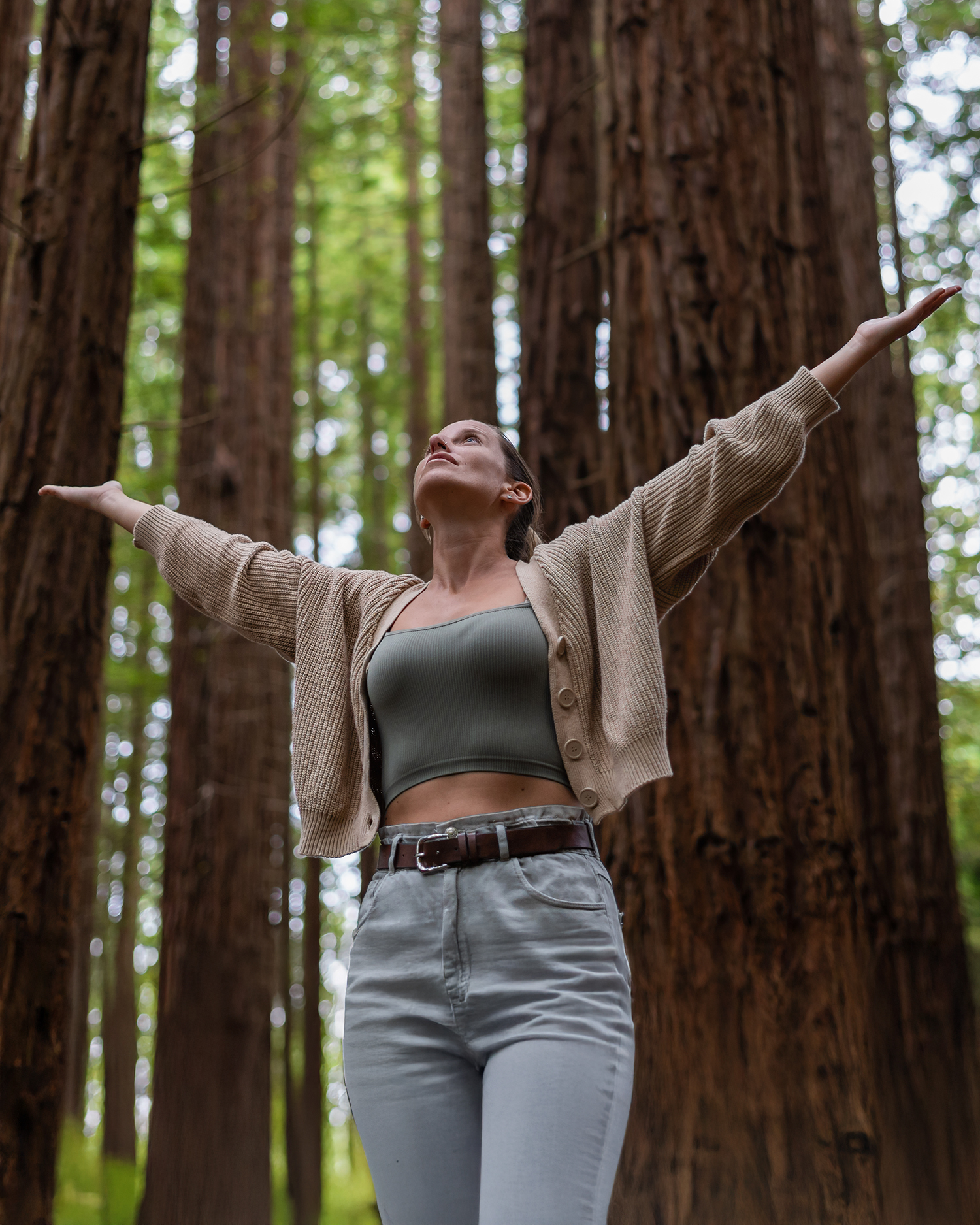 a woman in the redwood forest at Canyon Ranch Woodside
