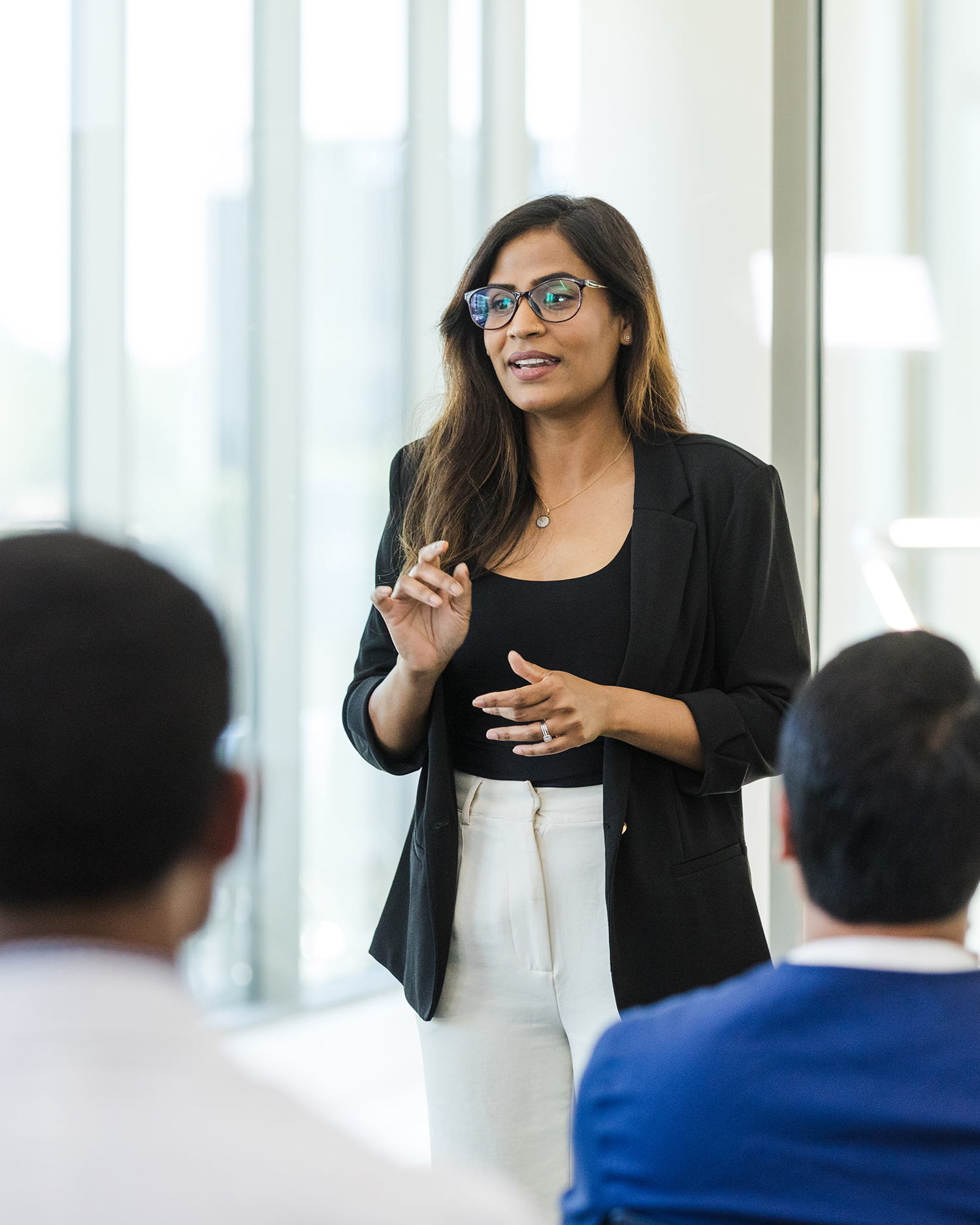a woman giving a medical education lecture
