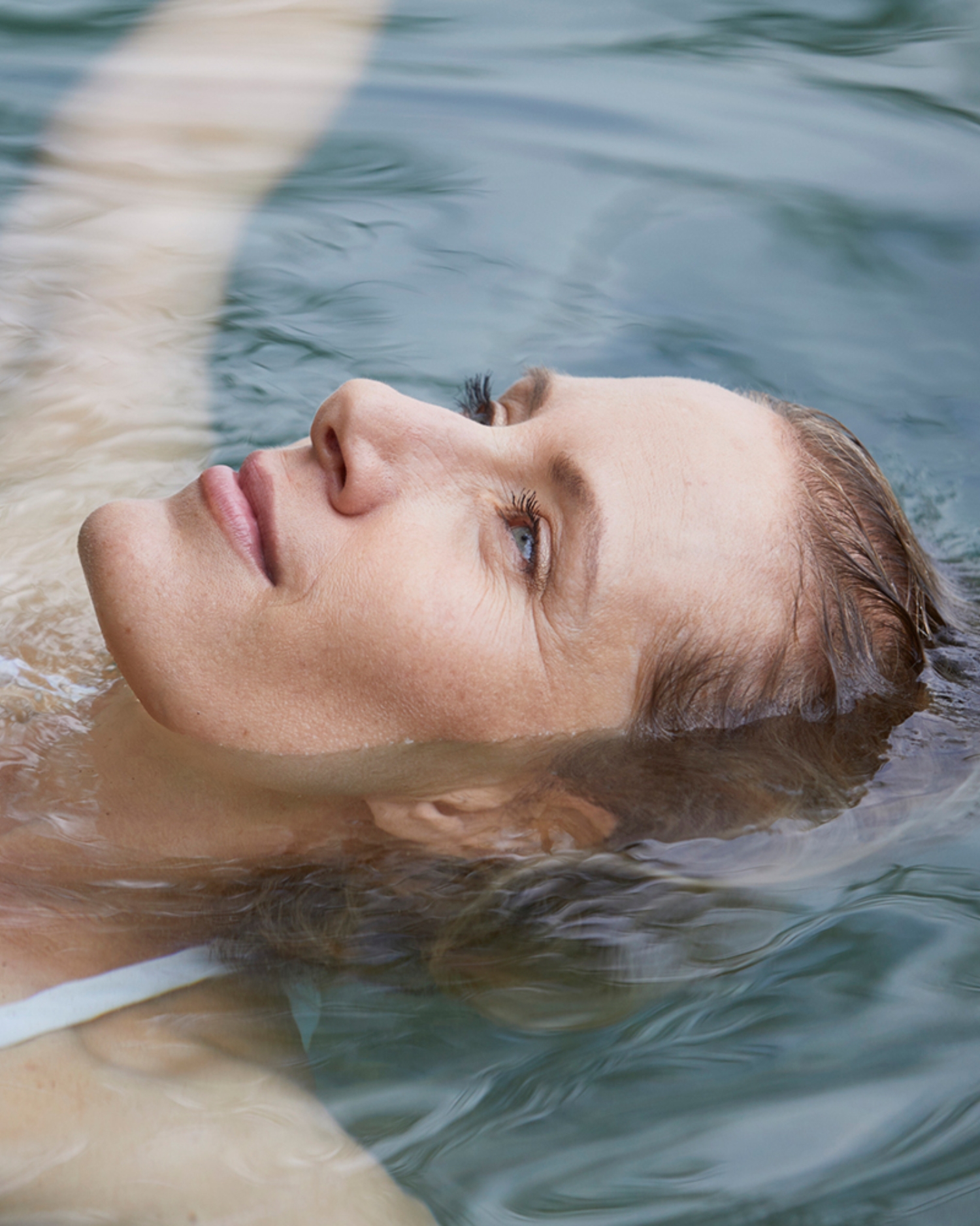 A woman floating on her back