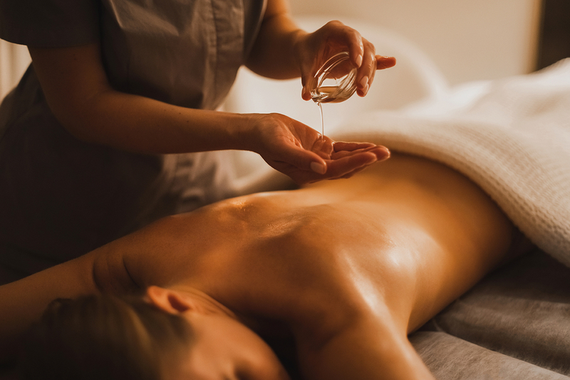 A woman getting a hot oil massage