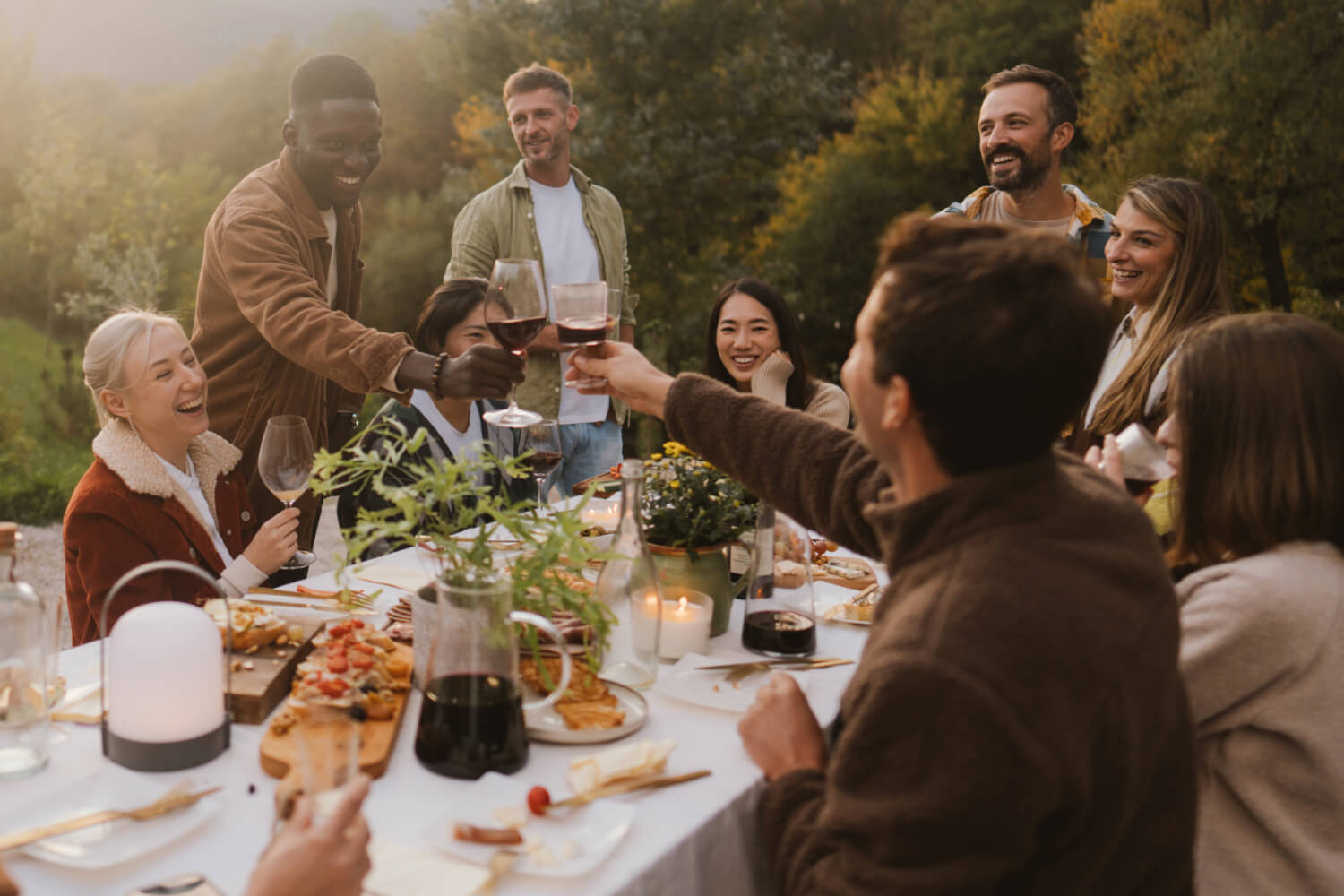 A group of people having dinner outdoors