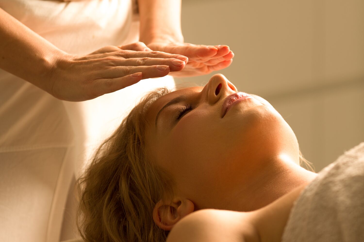 Woman Receiving Reiki Treatment